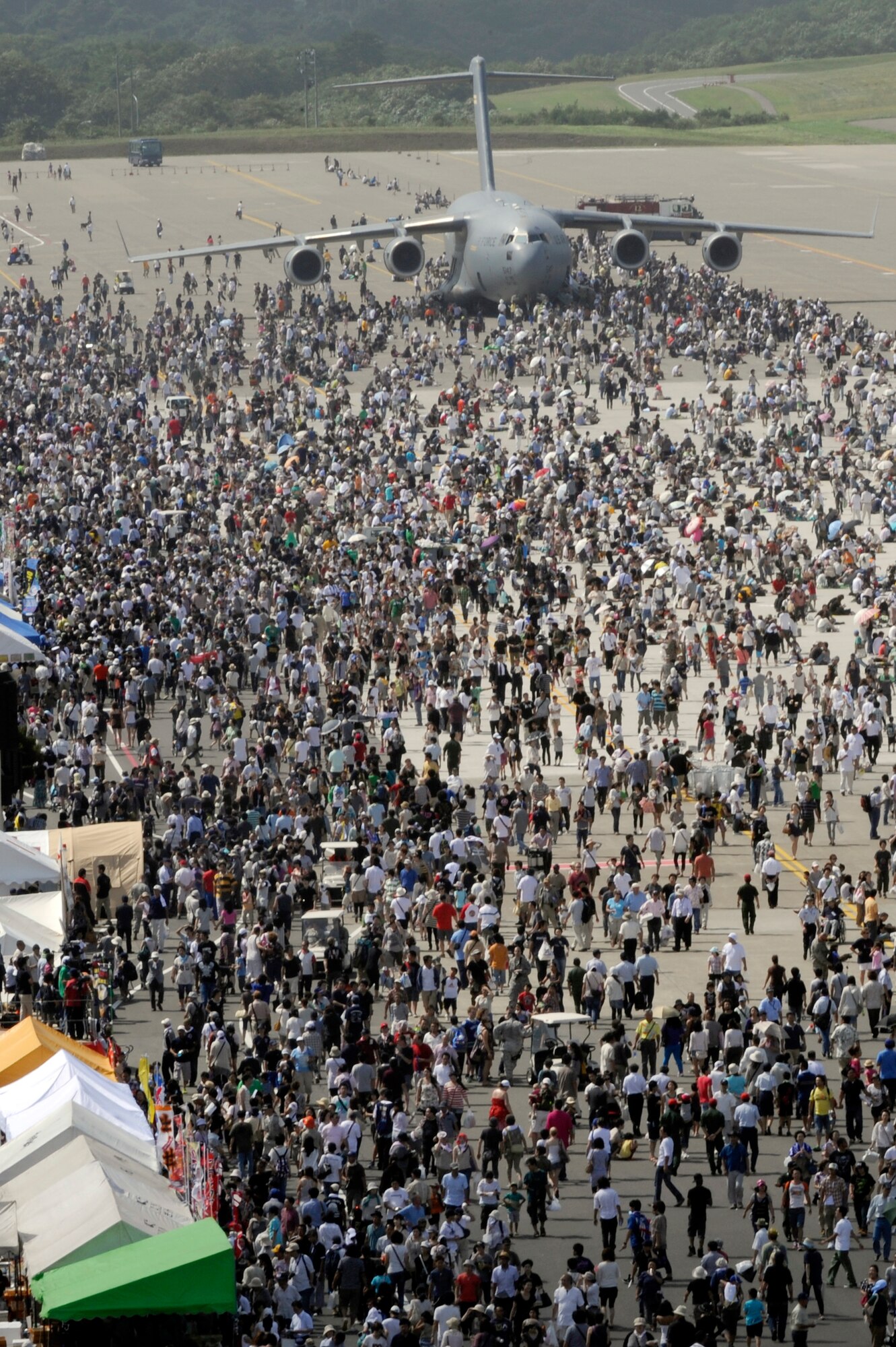 MISAWA AIR BASE, Japan - The Japan Air Self-Defense Force (JASDF) and the 35th Fighter Wing, with associated tenant units, hosted approximately 100,000 attendees at Misawa's 32nd annual air fest Sept. 4. Air Fest 2011 was an opportunity for visitors to see eight aerial demonstrations with 19 static displays of JASDF, U.S. Air Force, U.S. Navy aircraft and private operators. Air Fest 2011 also marked the last flight of Miss Veedol, a single engine aircraft that in 1931 flew non-stop across the Pacific Ocean from Sabishiro Beach, Misawa, Japan to Wenatchee, Washington, U.S. (U.S. Air Force photo/Tech. Sgt. Marie Brown)