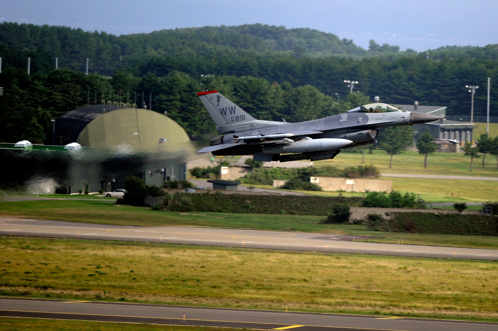 MISAWA AIR BASE, Japan - A U.S. Air Force F-16 Fighting Falcon takes off during the Misawa 32nd annual air fest Sept. 4. Air Fest 2011 was an opportunity for approximately 100,000 attendees to see eight aerial demonstrations with 19 static displays of Japan Air Self-Defense Force, U.S. Air Force, U.S. Navy aircraft and private operators. Air Fest 2011 also marked the last flight of Miss Veedol, a single engine aircraft that in 1931 flew non-stop across the Pacific Ocean from Sabishiro Beach, Misawa, Japan to Wenatchee, Washington, U.S. (U.S. Air Force photo/Tech. Sgt. Marie Brown)