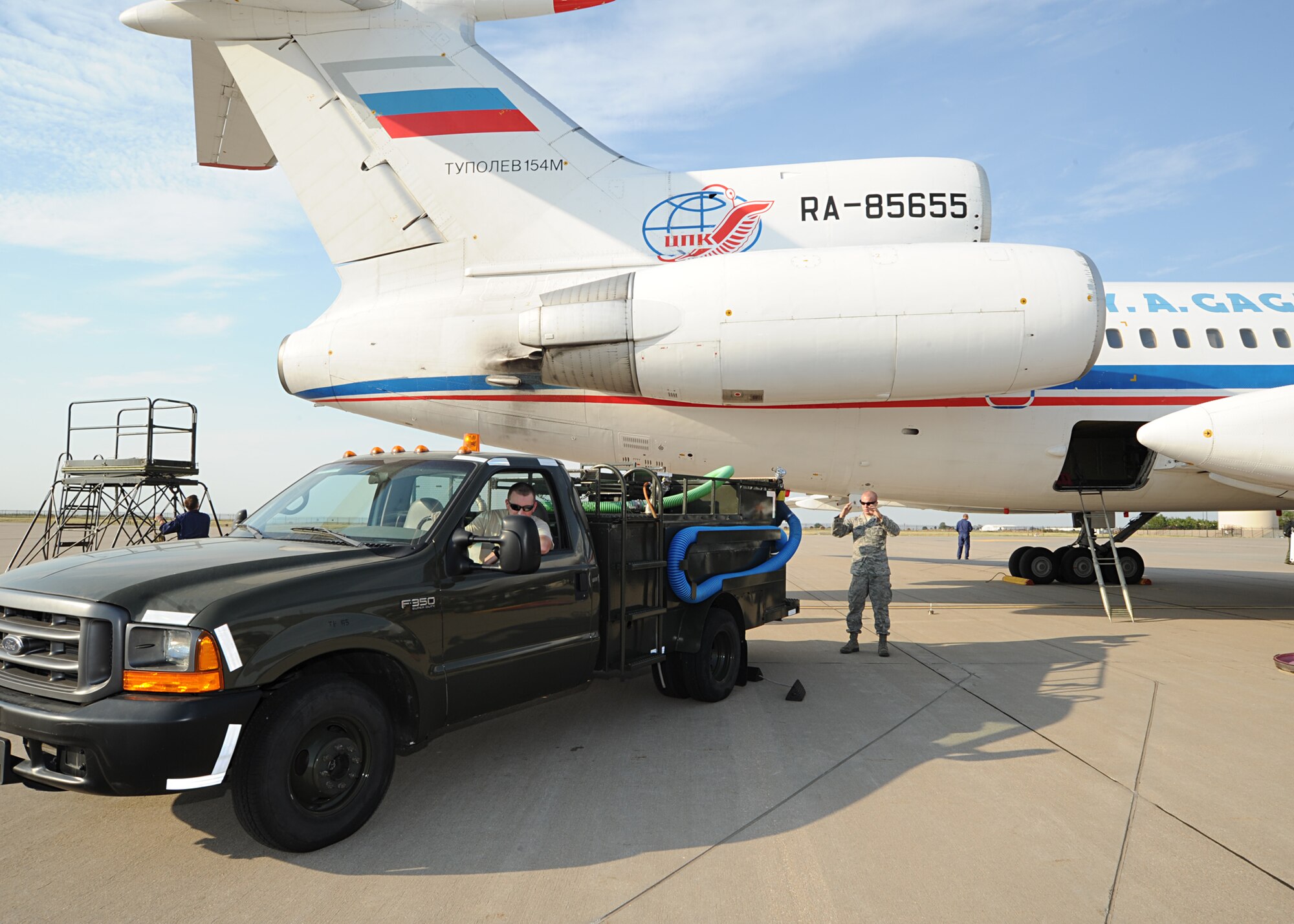 Airman 1st Class Anthony Underwood, 22nd Logistics Readiness Squadron fuels distribution operator, controls refueling operations for a Russian Tu-154M aircraft on McConnell’s flightline Aug. 29, 2011, McConnell Air Force Base, Kan.  Team McConnell hosted the August 2011 Open Skies Treaty Russian Federation twice in 2011.  The Open Skies Treaty was established in 1992 to enhance mutual understanding and confidence by giving participants to gather information about military forces and activities.  (U.S. Air Force photo by Senior Airman Maria A. Ruiz) 