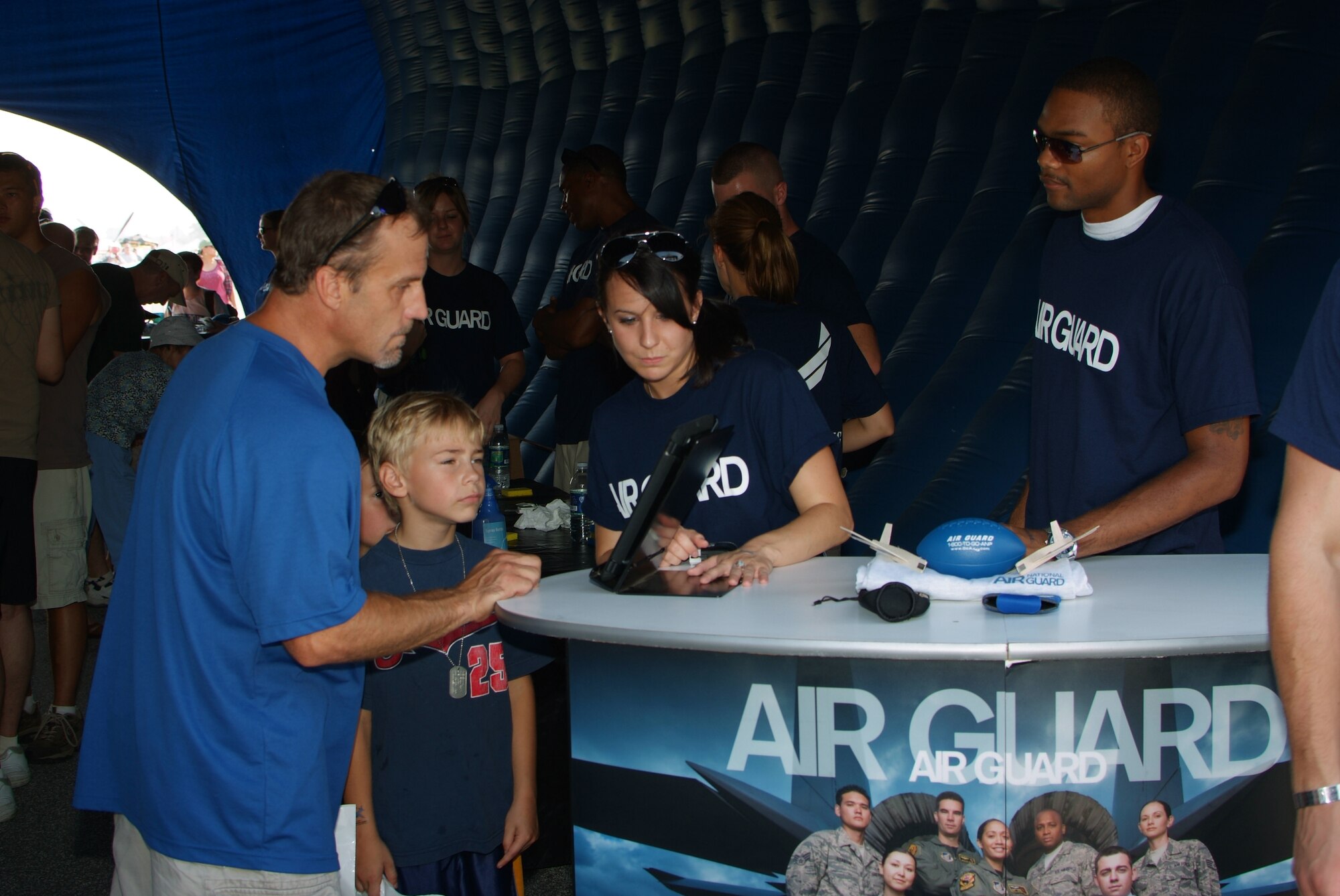 Recruiters from the 179th Airlift Wing and 200th REDHORSE Squadron interact with the crowd at the Cleveland Air Show in Cleveland, OH, September 3, 2011. All branches of the U.S. Military were preset as well as recruiters representing each at the event taking place at Burke Airport on the shores of Lake Erie.
(U.S. Air Force Photo by Staff Sgt. Robert J. Koehler)( Released)