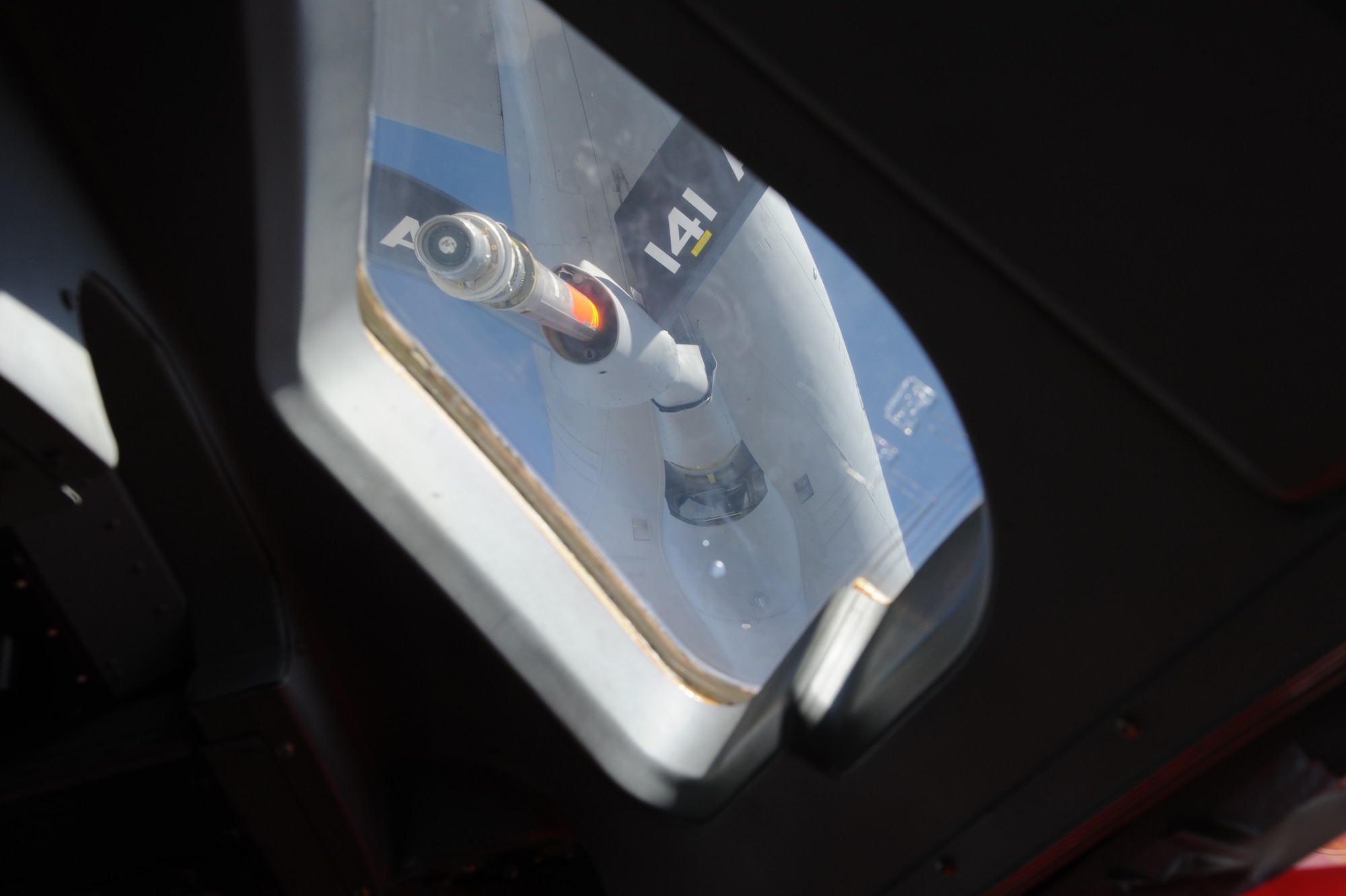A KC-135 Stratotanker prepares to connect a refueling boom to a C-17 Globemaser III during an aerial refueling operation in the skies over Kyrgyzstan Sept. 2. The refueling mission was part of an orientation flight designed to showcase aerial refueling procedures to key personnel at the Kyrgyz Ministry of Transportation and Communication, the Civil Aviation Agency, the Manas International Airport and the Kyrgyz Air Navigation military sector. (U.S. Air Force photo/Tech. Sgt. Hank Hoegen)