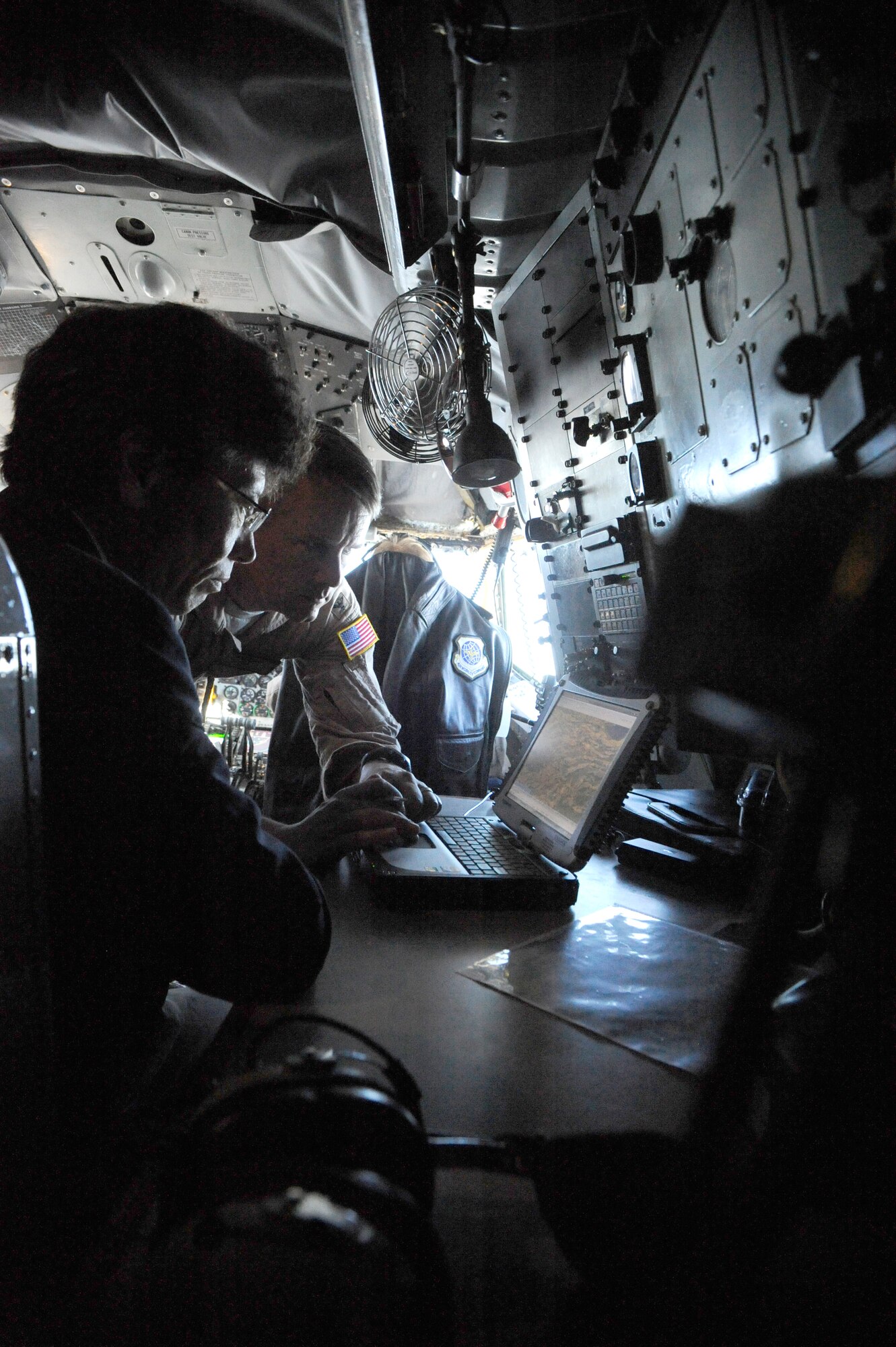 Col. James Jacobson shows a map to Mamat Nararov during an aerial refueling orientation flight on a KC-135 Stratotanker over the Kyrgyz Republic Sept. 2. Jacobson is deployed to the Transit Center at Manas, Kyrgyzstan, as the 376th Air Expeditionary Wing commander. Nararov is the Kyrgyz Republic Ministry of Transportation Civil Aviation Department chief. (U.S. Air Force photo/Tech. Sgt. Tammie Moore)