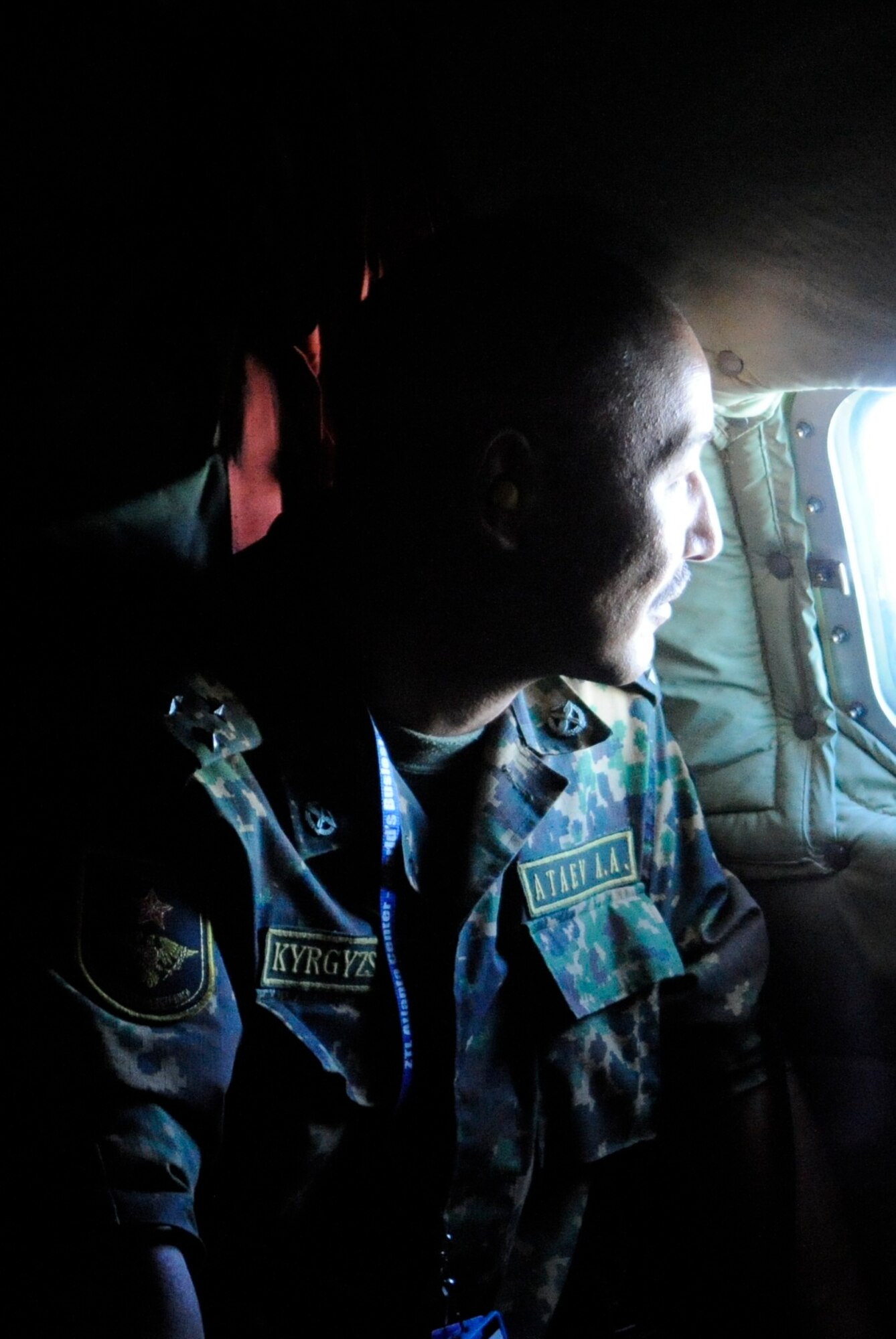 Kyrgyz Republic Col. Abdila-Akin Ataev looks out a KC-135 Stratotanker window during an orientation flight Sept. 2. Ataev is the Kyrgyz Air Navigation military sector chief. The KC-135 was flown by Airmen deployed to the 22nd Expeditionary Air Refueling Squadron at the Transit Center at Manas. (U.S. Air Force photo/Tech. Sgt. Tammie Moore)