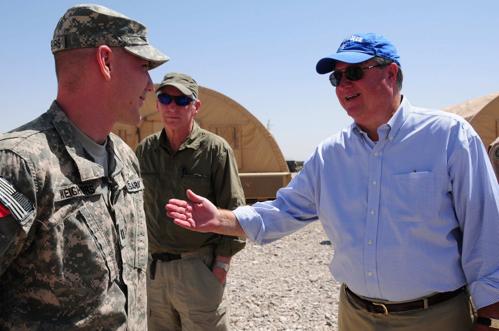 Secretary of the Air Force Michael Donley talks with U.S. Army Capt. John Neighbors at Shindand Air Base, Shindand, Afghanistan, September 5, 2011.  The secretary was in Afghanistan to meet with Airmen and officials there. (U.S. Air Force photo by Senior Airman Amber Williams)