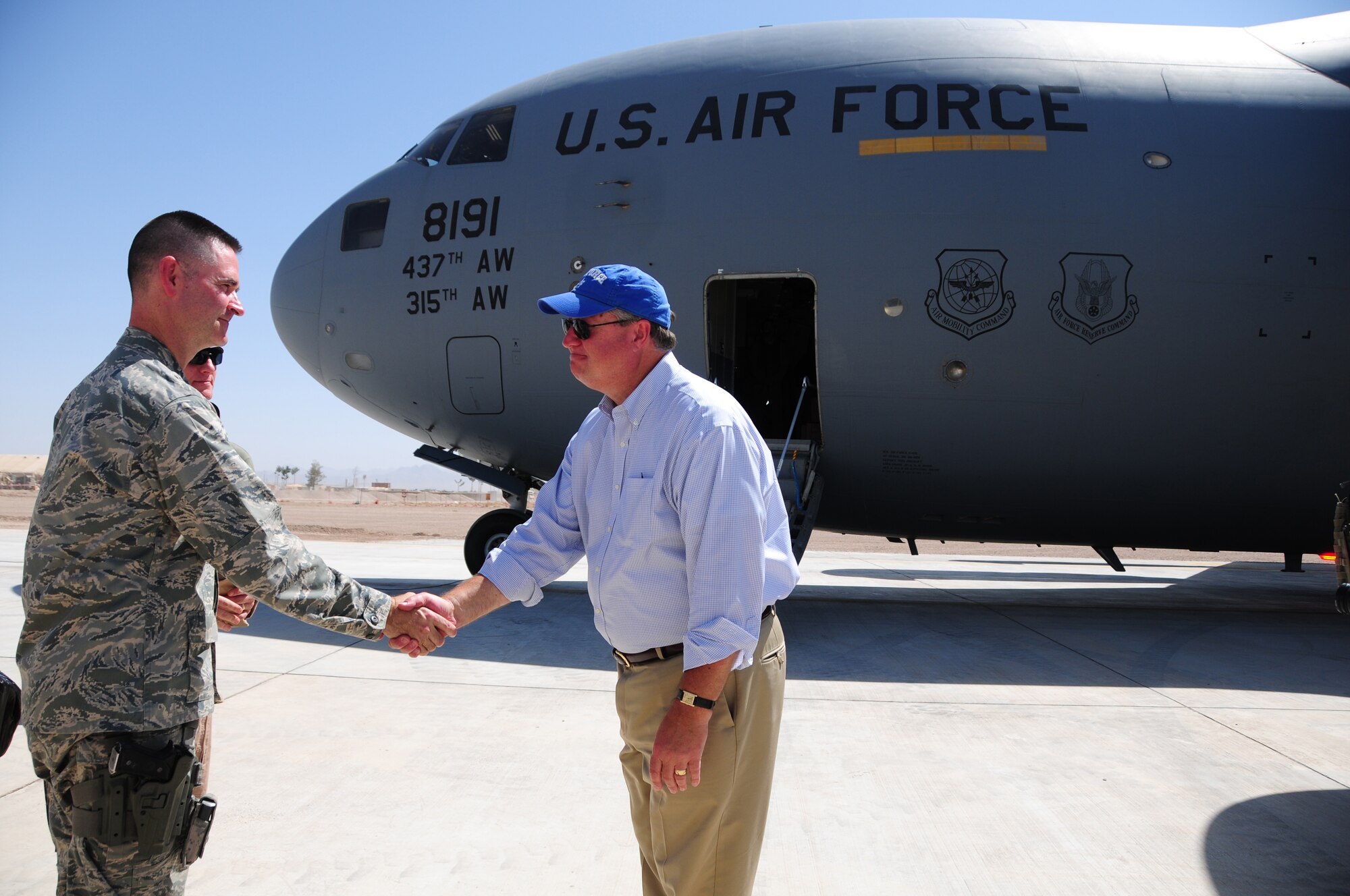Secretary of the Air Force Michael Donley shakes hands with Col. John Hokaj, 838th Air Expeditionary Advisory Group Commander, at Shindand Air Base, Shindand, Afghanistan, September 5, 2011.  The secretary was in Afghanistan to meet with Airmen and officials there. (U.S. Air Force photo by Senior Airman Amber Williams)