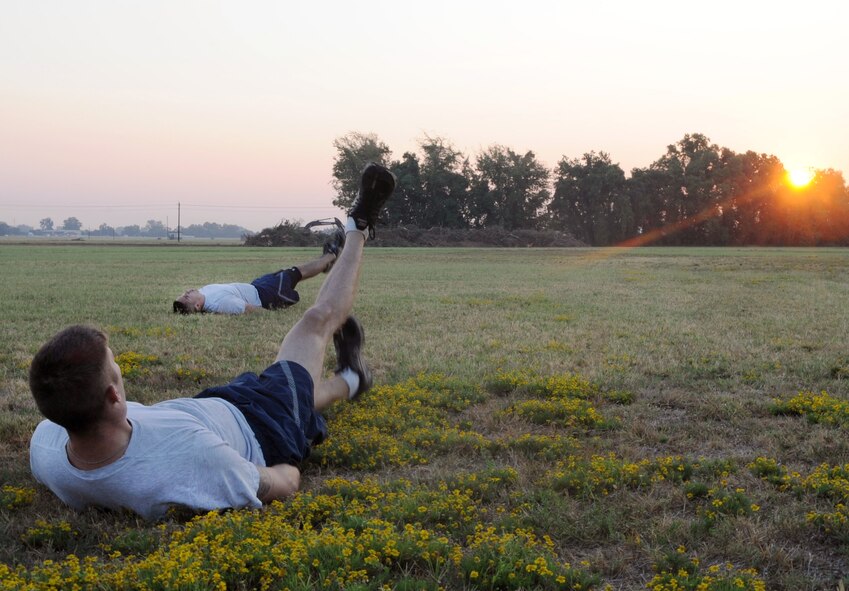 Members of the 2nd Security Forces Squadron at Barksdale Air Force Base, La., perform flutter kicks Sept. 1. during tryouts for the 2 SFS Global Strike Challenge team. The Airmen trying out for the team endure rigorous tests to evaluate their fitness, land navigation skills and marksmanship. (U.S. Air Force photo/2nd Lt. Tori Lalich)(RELEASED)