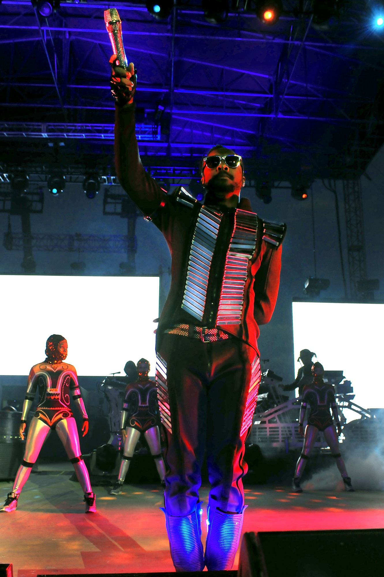 MINOT, N.D. -- Will.I.Am of The Black Eyed Peas perform for nearly 16,000 people at the North Dakota State Fairgrounds, as part of an event orchestrated by actor and Minot native, Josh Duhamel, to support the flood relief, here Sept. 3.  More than 200 Minot AFB Airmen volunteered to set up the electrifying evening, as a night of celebrity-filled fun comforted many Minot resident and Airmen who are still recovering from the tragic flood’s aftermath that displaced one-fourth of the city. All concert proceeds will go to the Minot Area Community Foundation’s Minot Area Recovery Fund to assist victims in Minot and surrounding flood affected communities. (U.S. Air Force Photo/Senior Airman Jesse Lopez)
