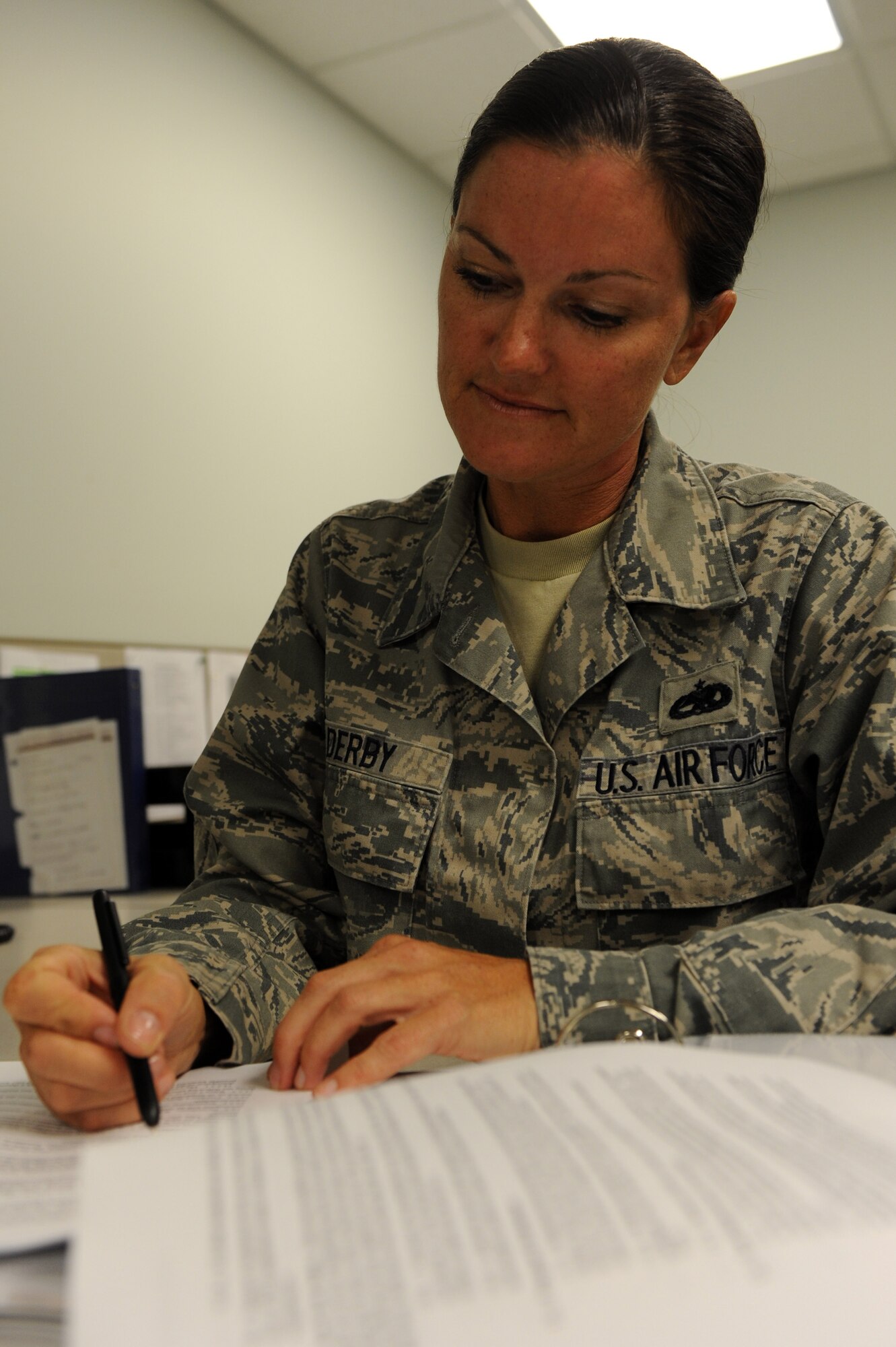 Tech. Sgt. Dana Derby, a 19th Maintenance group quality assurance inspector, reviews maintenance operation instructions Aug. 29, 2011. The Albuquerque, N.M., native oversaw the review and rewrite of 10 wing operating instructions and six Little Rock AFB instructions in preparation for the Logistics Compliance Assessment Program inspection. (U.S. Air Force photo by Airman 1st Class Rusty Frank)