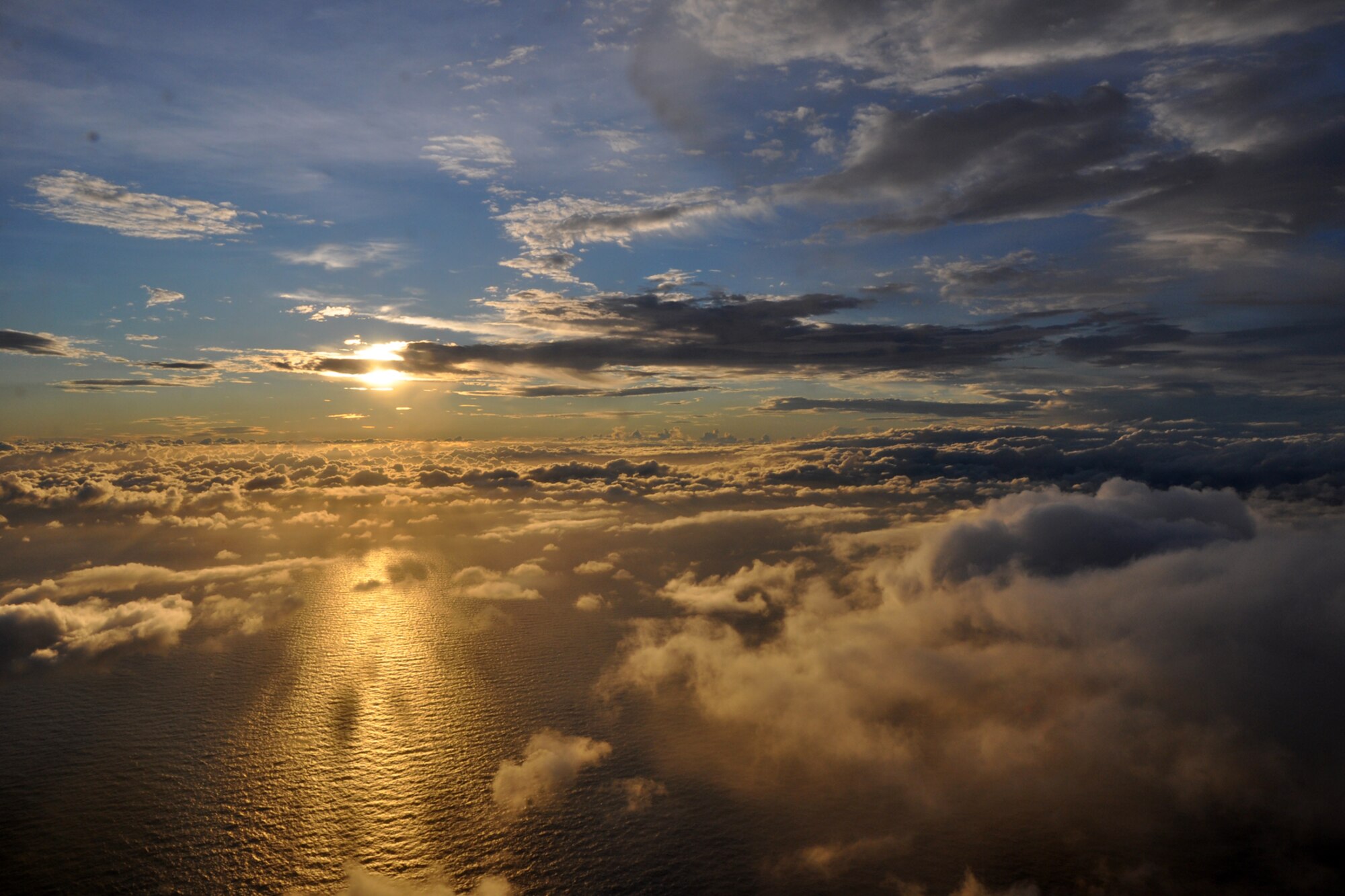 The sun sets as the clouds break after the WC-130J aircraft penetrates Tropical Storm Lee Sept. 2. The 53rd Weather Reconnaissance Squadron “Hurricane Hunters,” were gathering atmospheric data on the storm to send to the National Hurricane Center. The crew evacuated the aircraft to Houston ahead of the wind and rain from Tropical Storm Lee set to impact Keesler Air Force Base over Labor Day weekend. (U.S. Air Force photo by Staff Sgt. Valerie Smock)