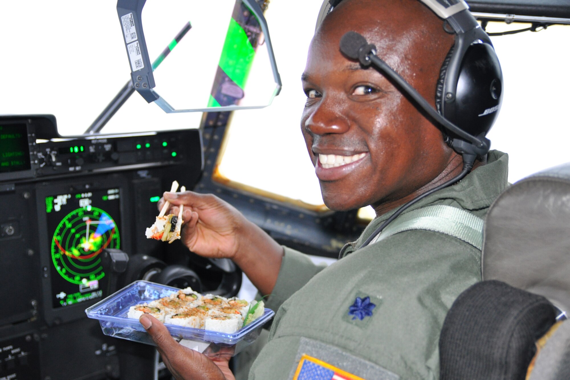 Lt. Col. Darryl Woods, 53rd Weather Reconnaissance Squadron pilot, takes a quick break to eat sushi before flying into Tropical Storm Lee Sept. 2. The crew was monitoring weather conditions in the storm, which was located in the Gulf of Mexico. (U.S. Air Force photo by Staff Sgt. Valerie Smock)
