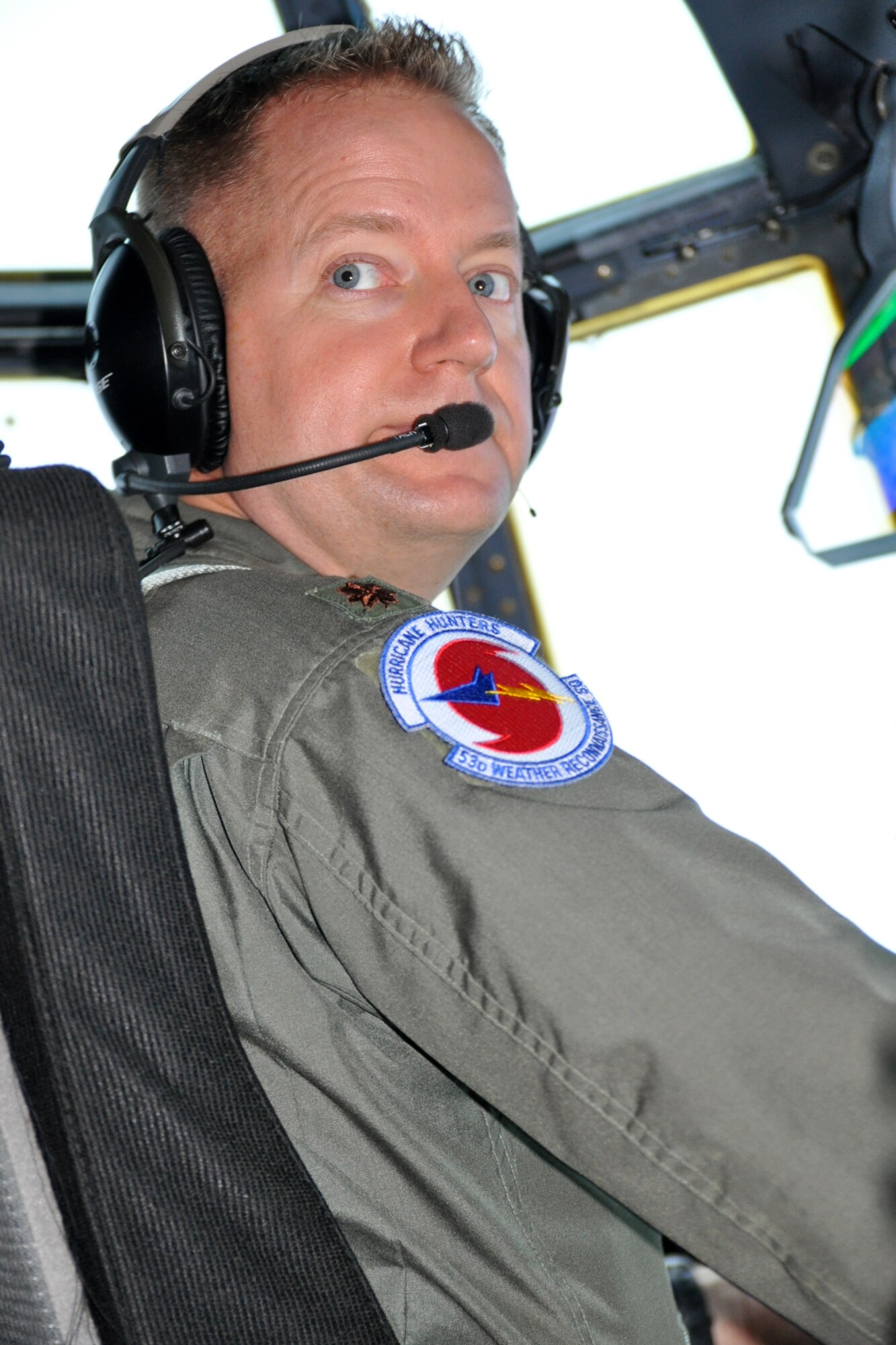 Maj. Sean Cross, 53rd Weather Reconnaissance pilot and aircraft commander, looks back at the navigator to confirm the aircraft's position as the crew prepares to fly into Tropical Storm Lee Sept. 2. Tropical Storm Lee was in the Gulf of Mexico and was heading toward the Gulf Coast. (U.S. Air Force photo by Staff Sgt. Valerie Smock)