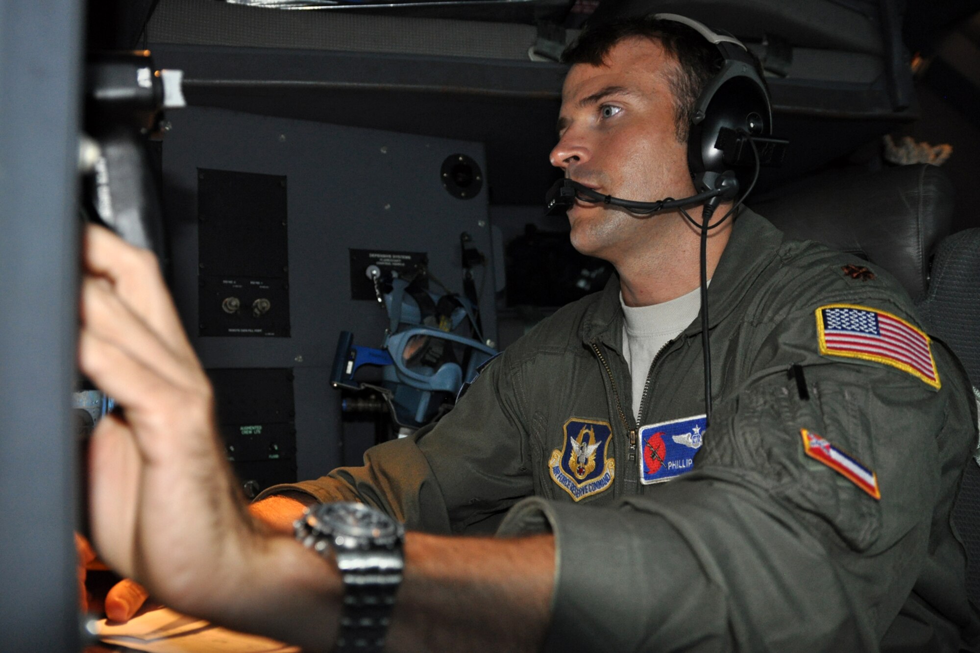 Maj. Phillip Dobson, a navigator with the 53rd Weather Reconnaissance Squadron, monitors the aircraft's track as the crew prepares to fly into Tropical Storm Lee Sept. 2. Dobson keeps track of the aircraft's position and movement and monitors radar to avoid tornadic activity. (U.S. Air Force photo by Staff Sgt. Valerie Smock)