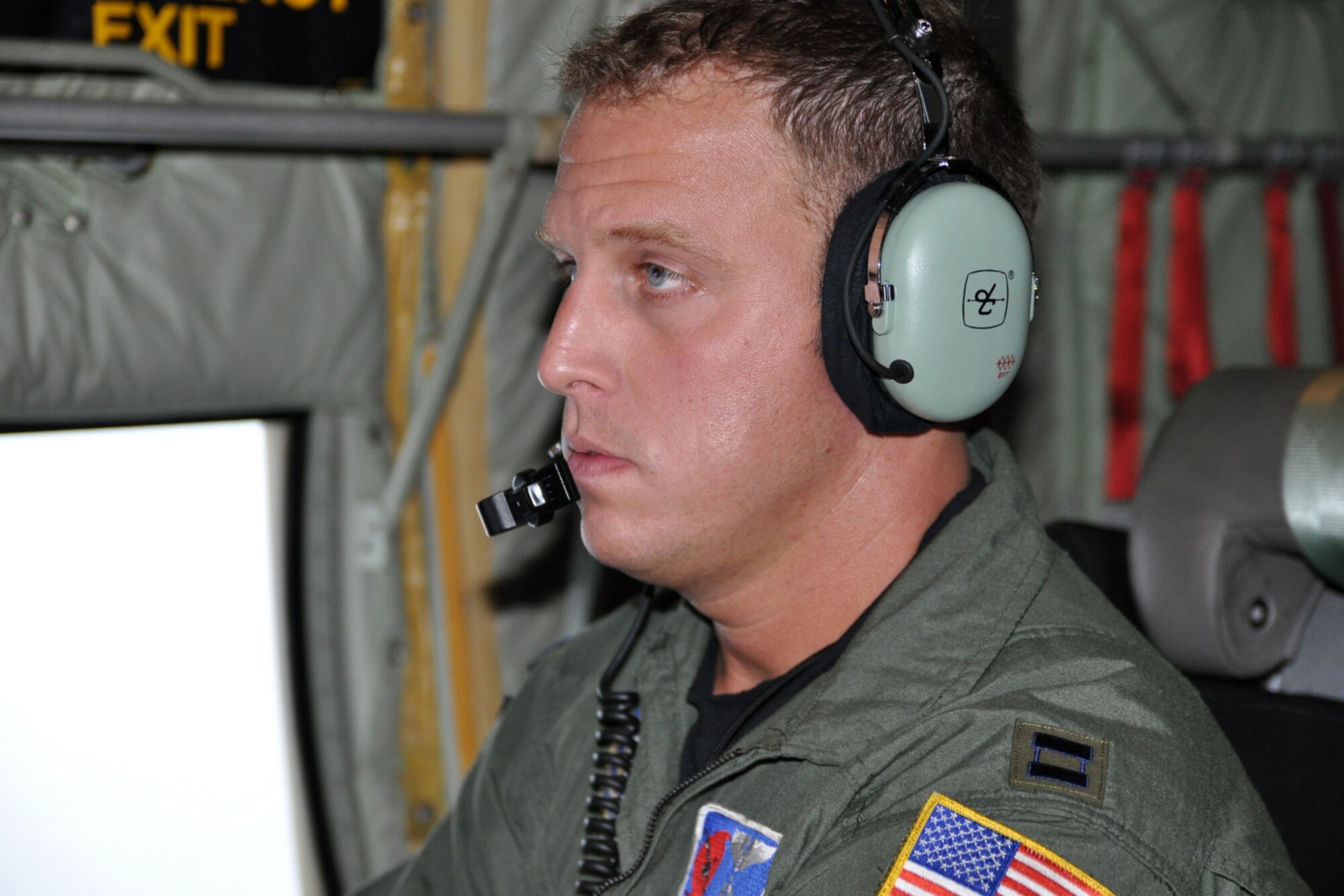Capt. Kyle Larson, an aerial weather reconnaissance officer assigned to the 53rd Weather Reconnaissance Squadron, monitors the weather while flying through Tropical Storm Lee Sept. 2. Larson observes and records meteorological data at flight level using a computer that encodes weather data every 30 seconds. (U.S. Air Force photo by Staff Sgt. Valerie Smock)
