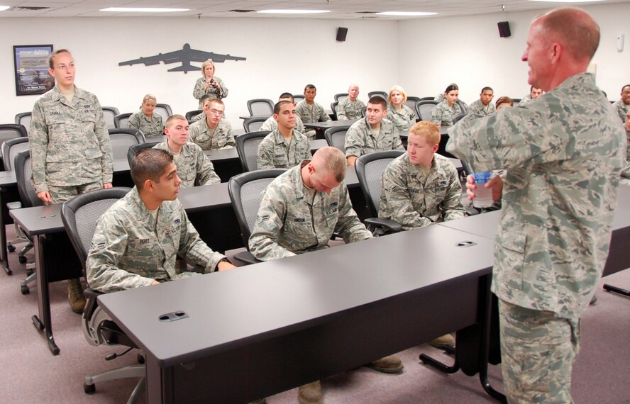 BARKSDALE AIR FORCE BASE, La. - Maj. Gen. Stephen Wilson, Eighth Air Force commander, talks with Airman 1st Class Kaitlin Caudle, 2nd Operation Support Squadron, during a visit to the First Term Airmen Center at Barksdale Air Force Base, La., Aug. 31. Wilson and Chief Master Sgt. Terry West, Eighth Air Force command chief, made their first official visit to the 2nd Bomb Wing to get to know how they could help the Airmen. (U.S. Air Force photo by Staff Sgt. Justin McMullen)