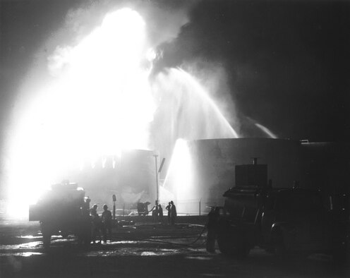 U.S. Air Force firefighters battle a fuel blaze started during an enemy attack against Tan Son Nhut in 1966. (Image courtesy of the Security Forces Museum).