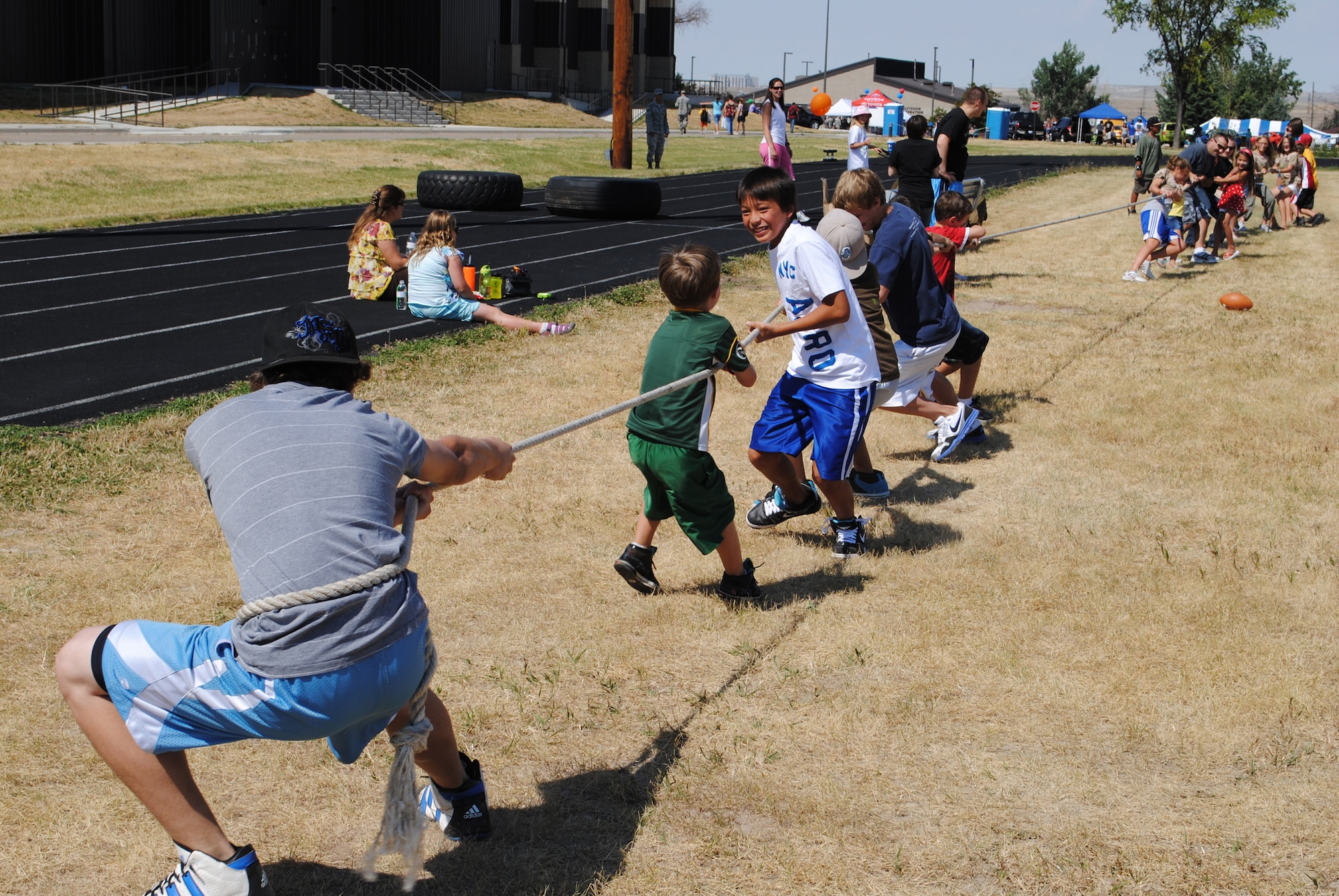 Children of all ages participated in the boys versus girls tug-of-war. (U.S. Air Force photo/Cortney Paxton)