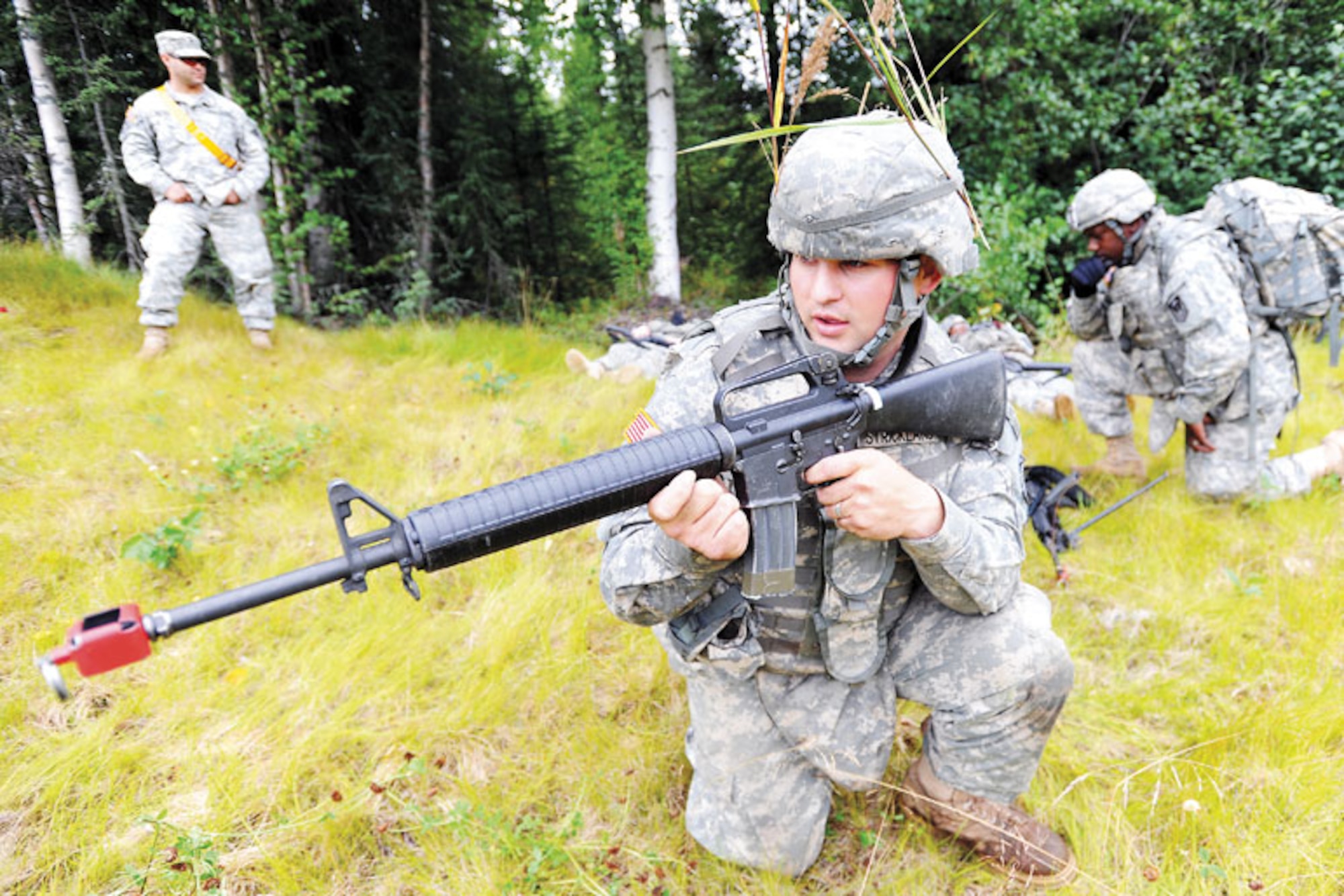 Pvt. Cameron Strickland maneuvers under the watchful eye of 95th Chem. observer controllers (U.S. Air Force photo/Justin Connaher)