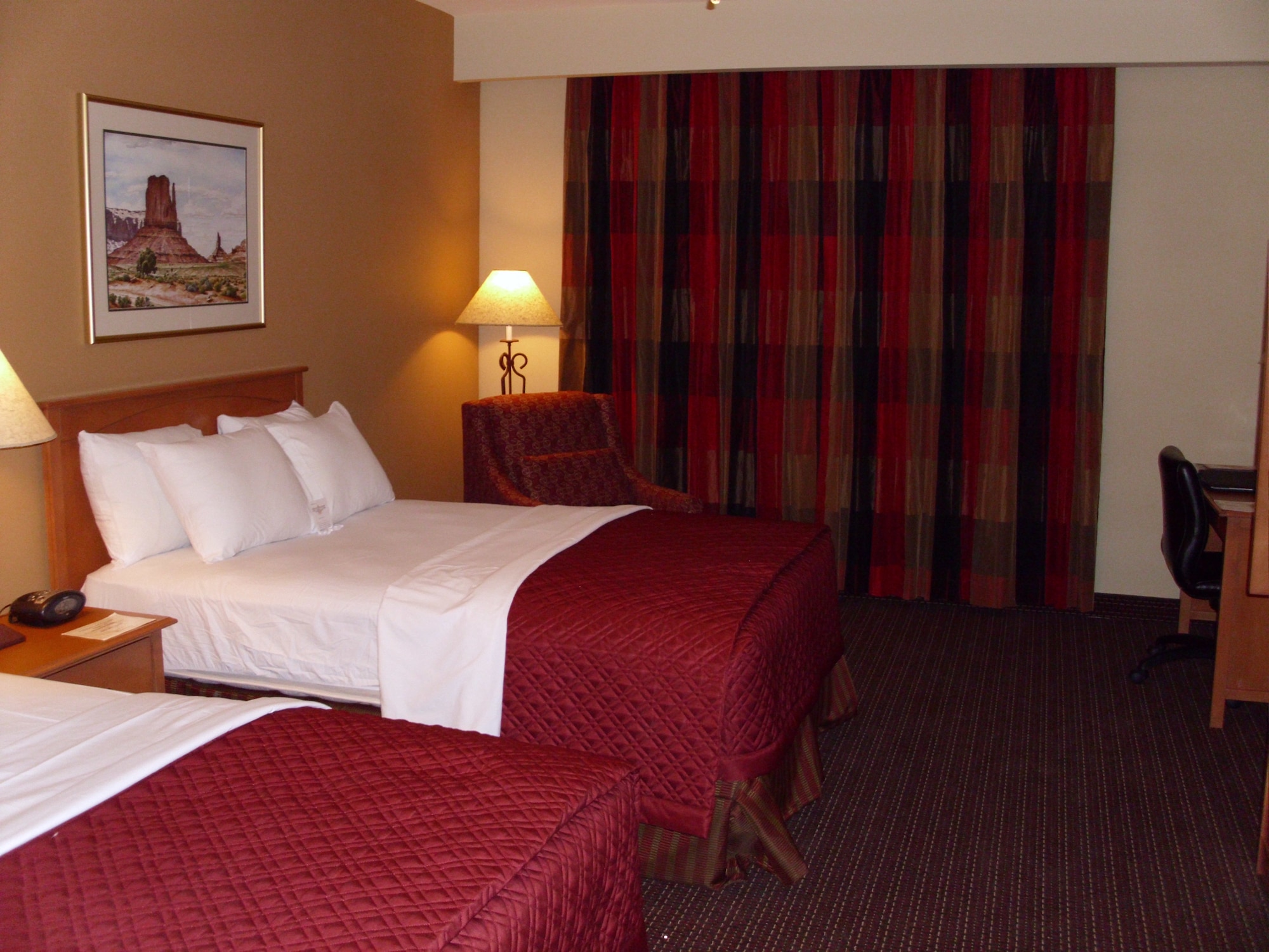 This is an “after” picture of one of the rooms in the Nellis Inn, Building 556, on Nellis Air Force Base, Nev.  Prior to September 2011, this building underwent a $3.2 million décor upgrade, which involved bringing new paint, flooring, mattresses, window treatments and coverlets into the rooms while leaving the existing bed frames, desks, armoires, lamps and light fixtures in-tact.  (Courtesy photo)