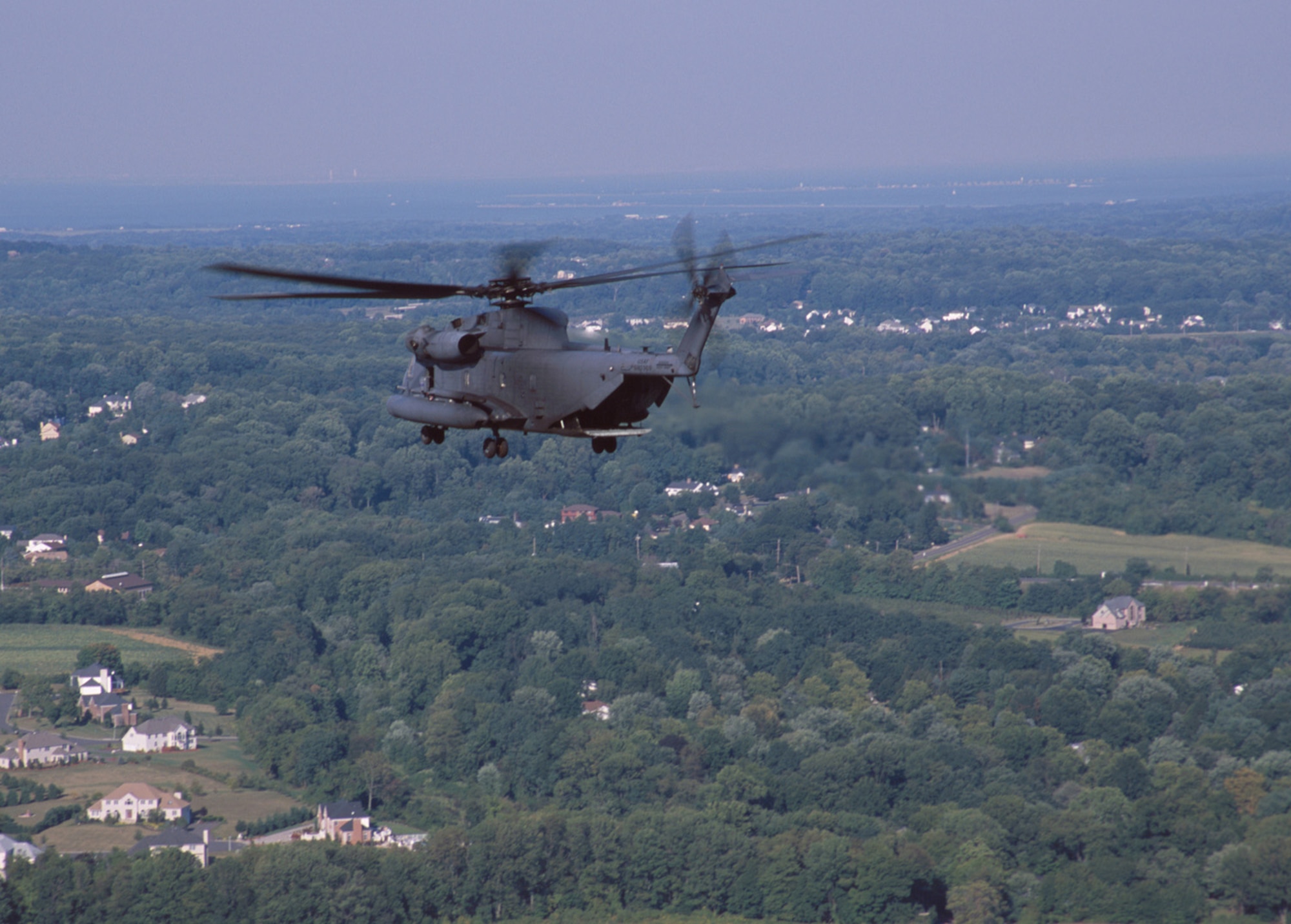 An MH-53, Air Force Special Operations helicpoter from Hurlburt Field, Fla., enroute to New York City from McGuire Air Force Base, N.J., on Sept. 13, 2001. The aircraft are being used for relief operations to lower Manhattan, in the wake of the terrorist attacks on the World Trade Center. (U.S. Air Force photo by Gary Ell) (Released)

