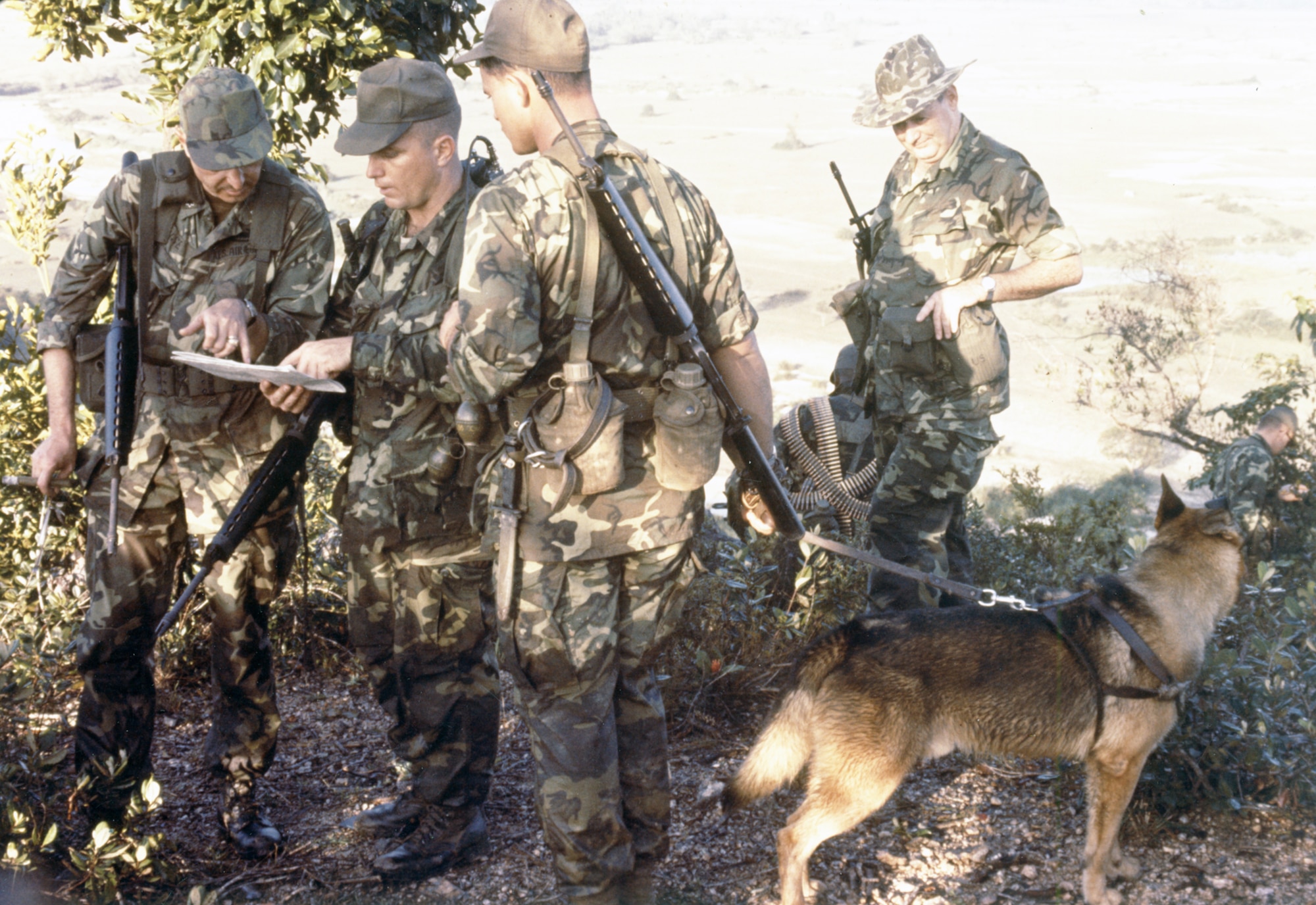Security Police team with a dog on an early morning reconnaissance patrol near Phu Cat Air Base, South Vietnam, in 1967. (U.S. Air Force photo).