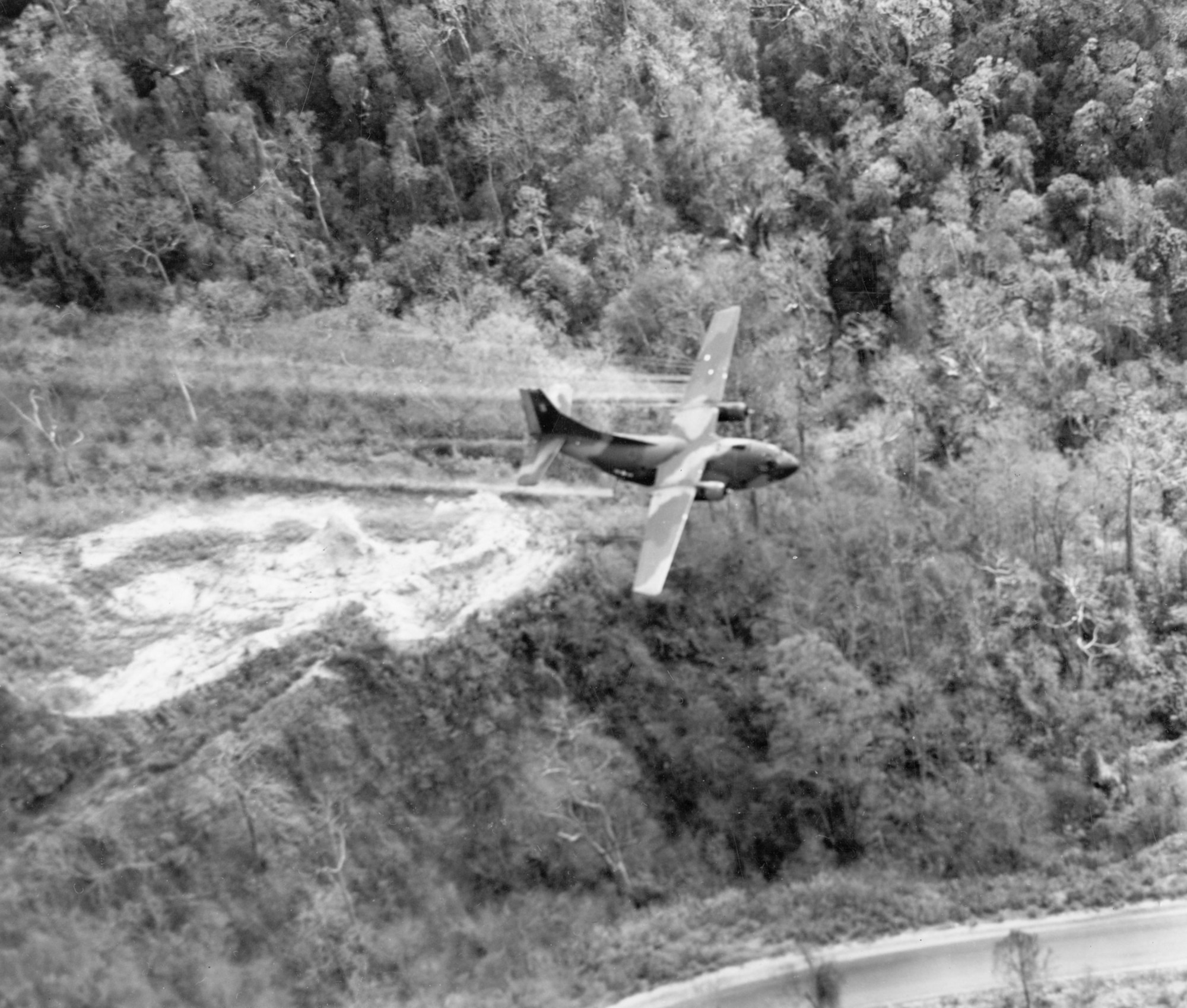 U.S. Air Force Ranch Hand crews sprayed defoliants to clear jungle hiding places around air base perimeters. (U.S. Air Force photo).