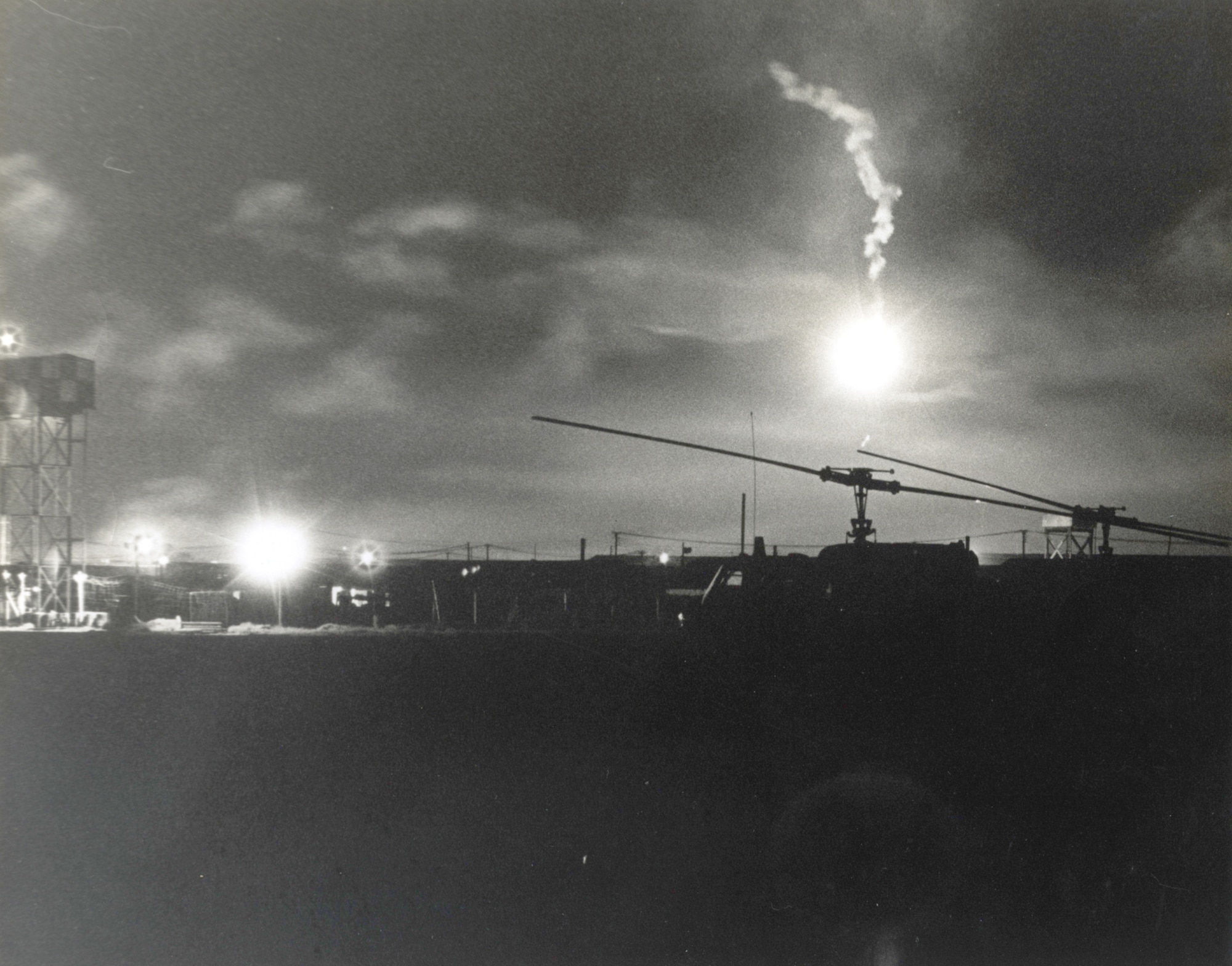 Flares light the night sky during an attack on Tan Son Nhut in December 1966. (Image courtesy of the Security Forces Museum).