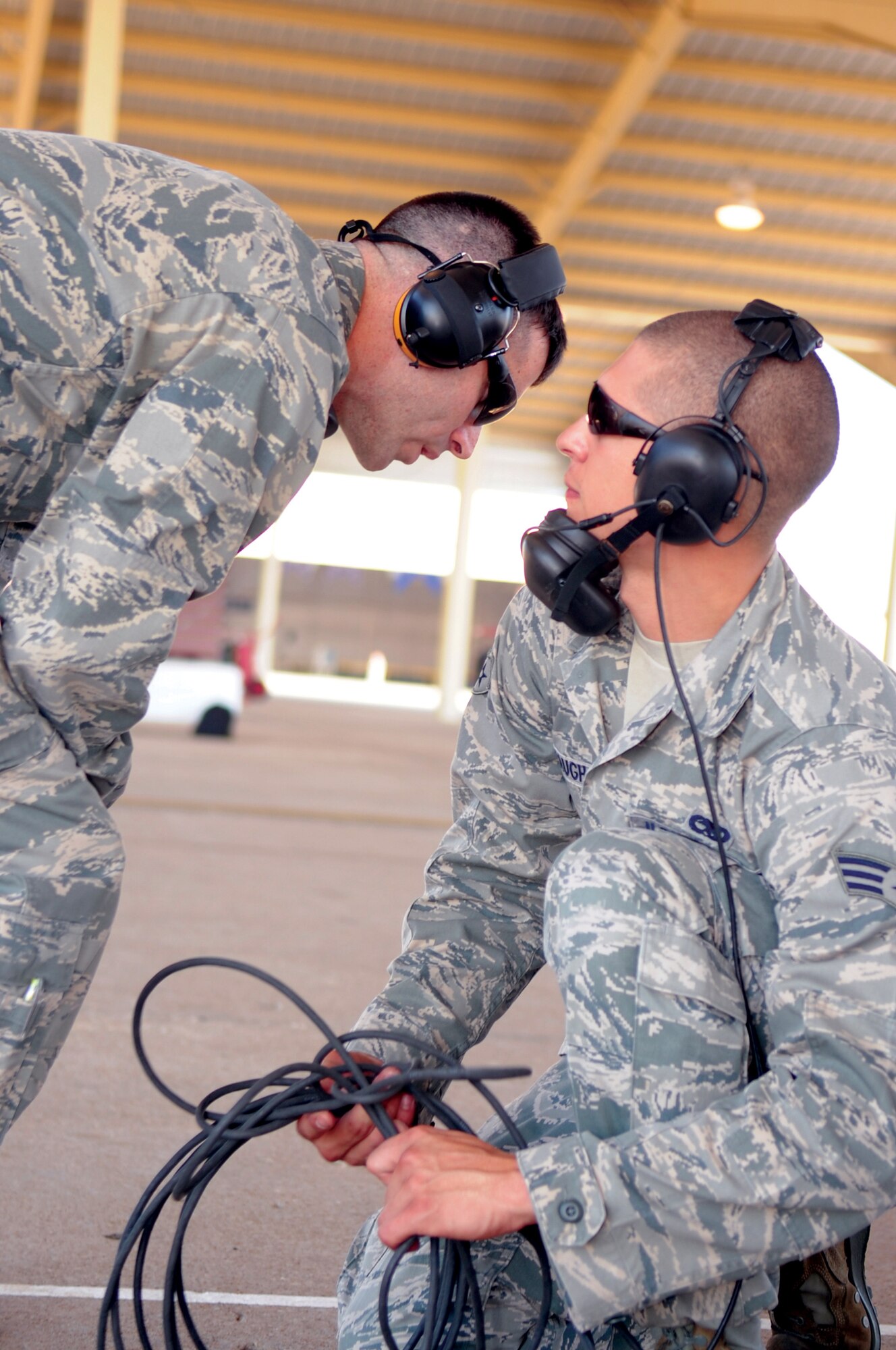 Capt. James Patrick Chevalier, 442nd Maintenance Group, congratulates Senior Airman Kenneth Vaughn, 442nd Aircraft Maintenance Squadron crew chief, after 14 aircraft departed on schedule with no discrepancies during a phase-one operational readiness inspection, Aug. 27. The 442nd Fighter Wing is an A-10 Thunderbolt II Air Force Reserve unit at Whiteman Air Force Base, Mo. (U.S. Air Force photo/ Staff Sgt. Danielle Wolf)