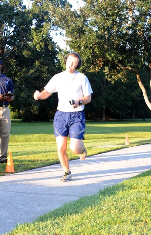 First Lieutenent Ryan Peake finishes first in the Commander's Fitness Challenge, Sept. 1, at Joint Base Charleston, S.C. Peake ran the challenge in 17:27 and is assigned to the 628th Family Support Squadron. (U.S. Air Force photo/Airman 1st Class Ashlee Galloway)