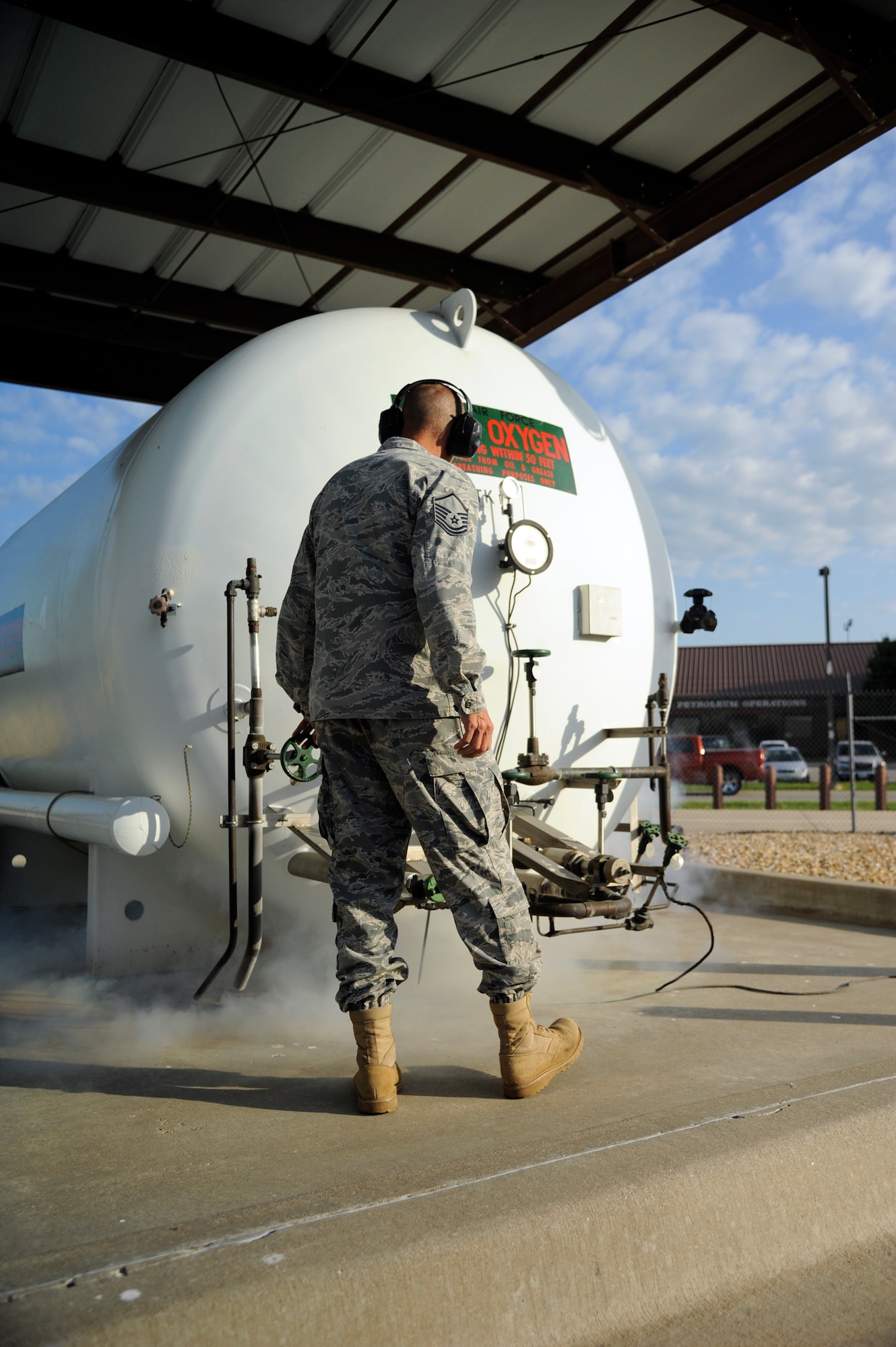 WHITEMAN AIR FORCE BASE, Mo. - Master Sgt. Daniel Koch, 509th Logistics Readiness Squadron fixed-facilities fuels technician, inspects an oxygen tank here Aug. 31. The fixed-facility shop is a part of fuels and handles cryogenics (pilot oxygen tanks), base service systems (fuel for government vehicles) and hydrant systems (fuel being sent to and received from flightline docks). (U.S. Air Force photo/Airman 1st Class Cody H. Ramirez)