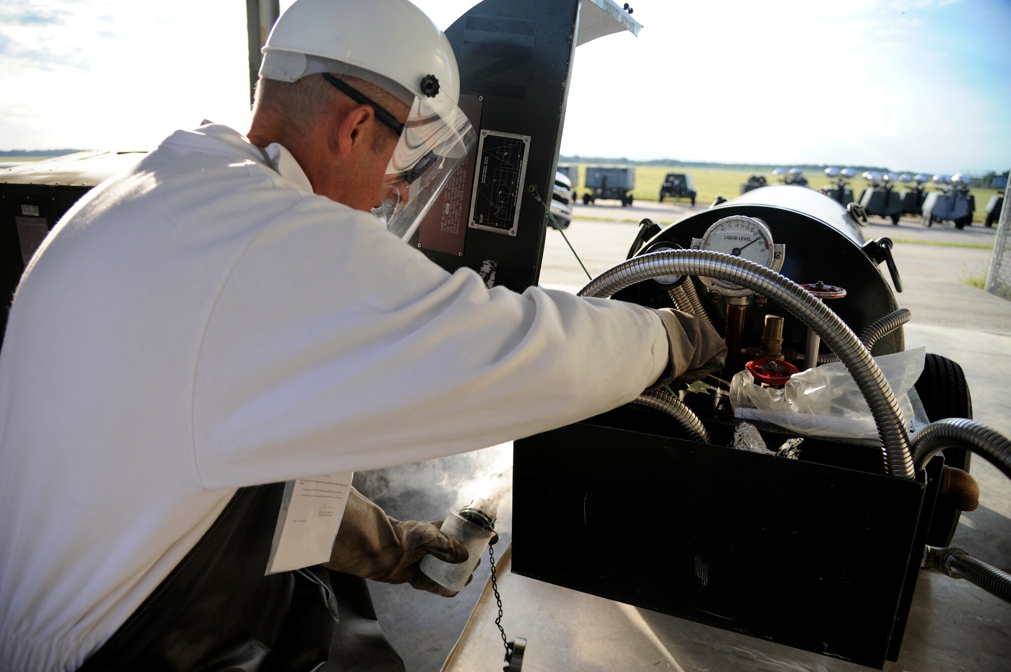 WHITEMAN AIR FORCE BASE, Mo. - Master Sgt. Daniel Koch, 509th Logistics Readiness Squadron fixed-facilities fuels technician, checks the air quality in an oxygen tank here Aug. 31 ensuring the safety of B-2 Spirit and T-38 Talon pilots here. The fixed-facility shop is a part of fuels and handles cryogenics (pilot oxygen tanks), base service systems (fuel for government vehicles) and hydrant systems (fuel being sent to and received from flightline docks). (U.S. Air Force photo/Airman 1st Class Cody H. Ramirez)