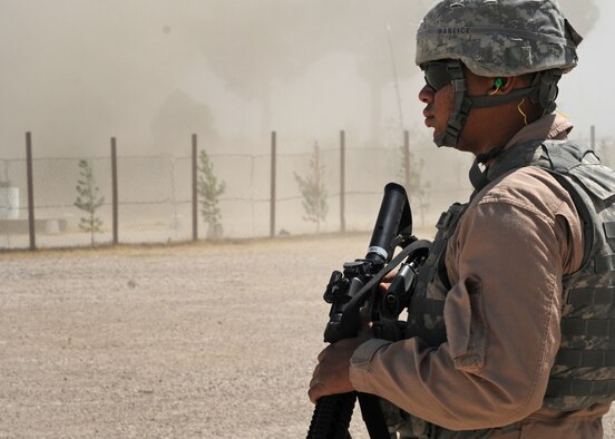 BAGRAM AIRFIELD, Afghanistan – Airman 1st Class Dominique Maniece, 455th Expeditionary Security Forces Squadron Fly Away Security Team member, provides security for a C-130J Hercules aircraft, Sept. 9. Maniece is stationed at Altus Air Force Base, Okla. (U.S. Air Force photo/Senior Airman Krista Rose)