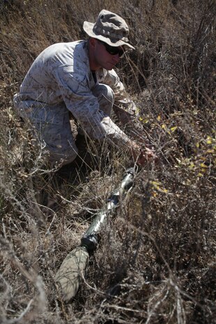 U.S. Marine Cpl. Elizabeth Cisneros prepares an explosive device made of C-4 during improvised explosive device (IED) training on Target Island, Marine Corps Air Station Iwakuni, Japan, September 7, 2011. U.S. Marines trained hand-in-hand with EOD technicians on various explosive devices and hazardous material while also learning the dangers of each. (U.S. Marine Corps photo by Lance Cpl. Kassie L. McDole/Released)