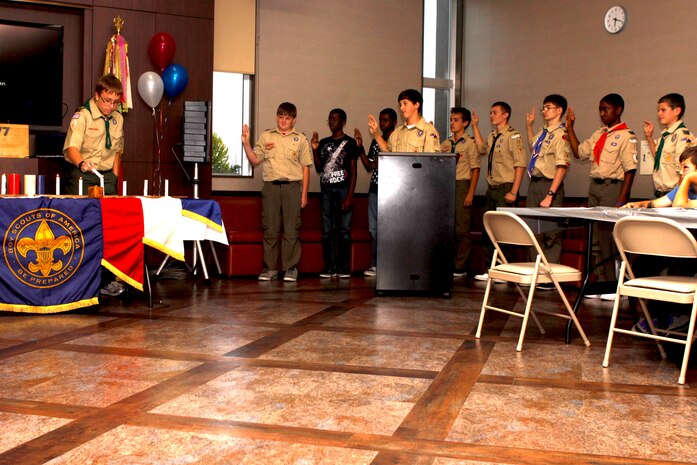 Taylor R. Marine, 13, a Troop 77 Eagle Scout, leads his fellow Scouts in reciting the Scout Oath during Troop 77's Court of Honor ceremony at Yujo Hall here Sept. 7. The Court of Honor ceremony is hosted once a year and publicly recognizes Scouts for their achievements.