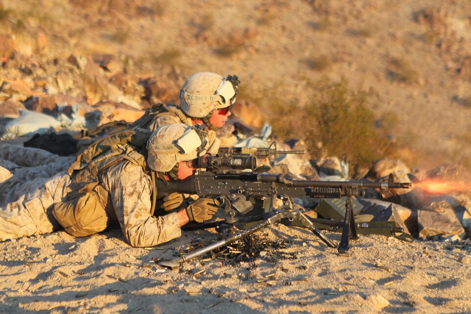 Lance Cpl. Brandon Lee [front] a machine gunner with Company I, 3rd Battalion, 3rd Marine Regiment, lays down suppressive fire with his M240G while Lance Cpl. Tyler Connor, a team leader with Co. I, 3/3, directs the machine gun bursts during a platoon size attack at the Combat Center’s Range 410A Sept. 7, 2011.