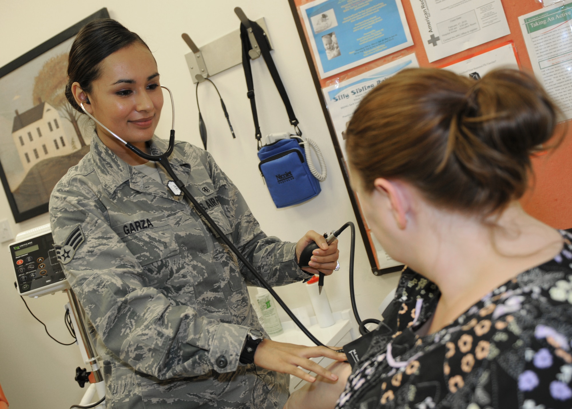 ROYAL AIR FORCE LAKENHEATH, England - Senior Airman Valeria Garza, 48th Women's Health Services aerospace medical technician, checks a patient's blood pressure on Sept. 2, 2011. Garza was nominated for a Liberty Spotlight because she displays the core value of "Service Before Self". (U.S. Air Force photo by Airman Cory Payne) 
