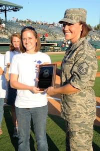 Master Sergeant Amanda Lynch receives the "Military Woman of the Year 2011" award at the Military Appreciation night before the Charleston RiverDogs game Sept.1, at Joe Riley Stadium. The "Military Woman of the Year 2011" award was presented by the Women in Defense (a National Security Organization) Palmetto Chapter. (U.S. Air Force photo/Airmen 1st Class Ashlee Galloway)