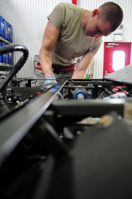 SPANGDAHLEM AIR BASE, Germany – Airman 1st Class Matthew Bridwell, 52nd Equipment Maintenance Squadron aerospace ground equipment journeyman, installs an air filter on an MJ-1B bomb lift here Sept. 6. The aerospace ground equipment flight is responsible for providing and maintaining both powered and non-powered AGE to support the 52nd Fighter Wing’s flying operations. (U.S. Air Force photo/Airman 1st Class Matthew B. Fredericks)