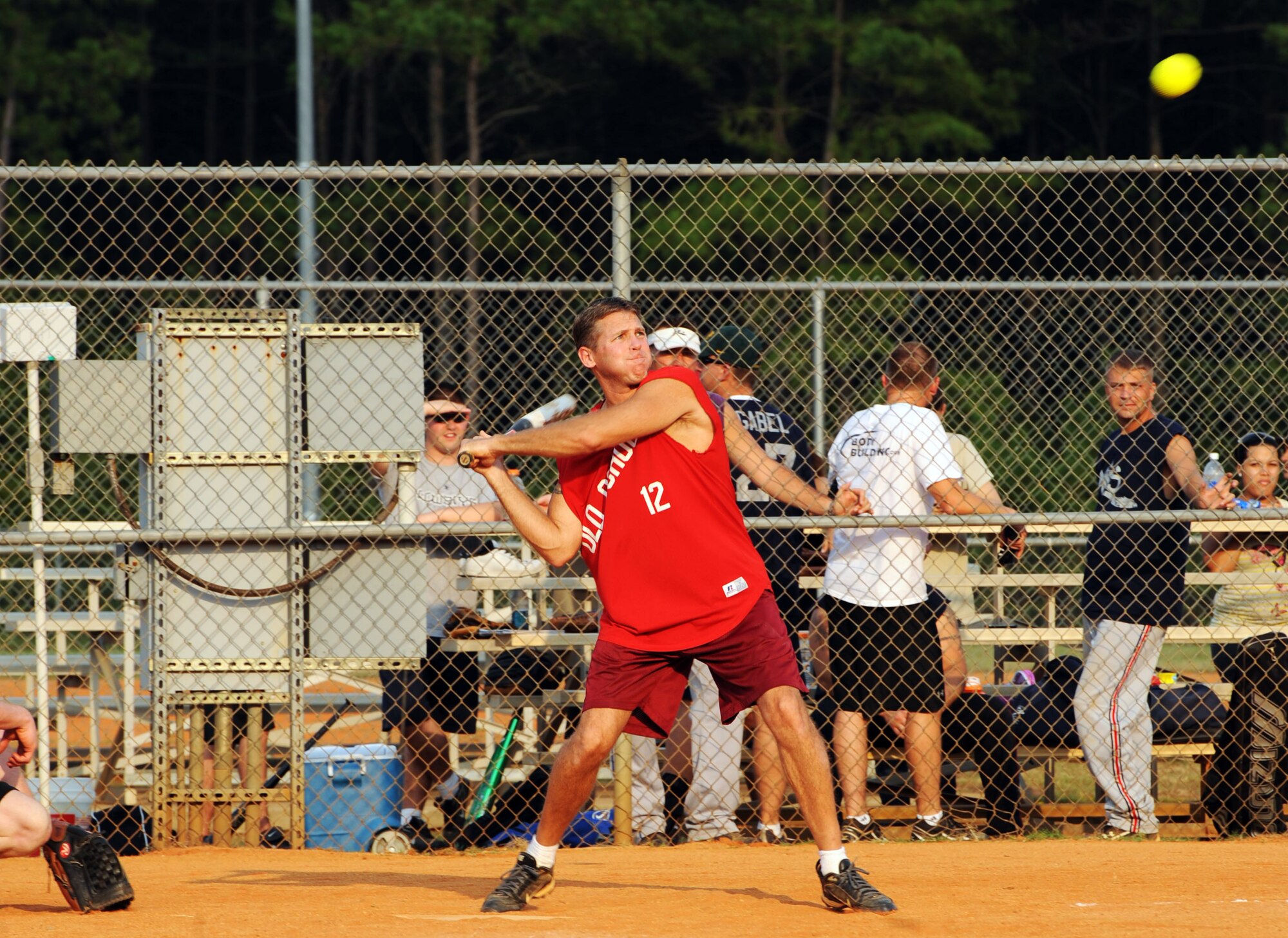 Jeff Jacobs, a retired U.S. Air Force senior master sergeant, hits the softball during the 20th Component Maintenance Squadron "Shockers" versus 20th Mission Support Group "Old School" intramural softball game at the outdoor sports complex, Shaw Air Force Base, S.C., Aug. 30, 2011. The Shockers won the game 11 to 3. (U.S. Air Force photo/Airman 1st Class Tabatha L. Duarte)(Released)