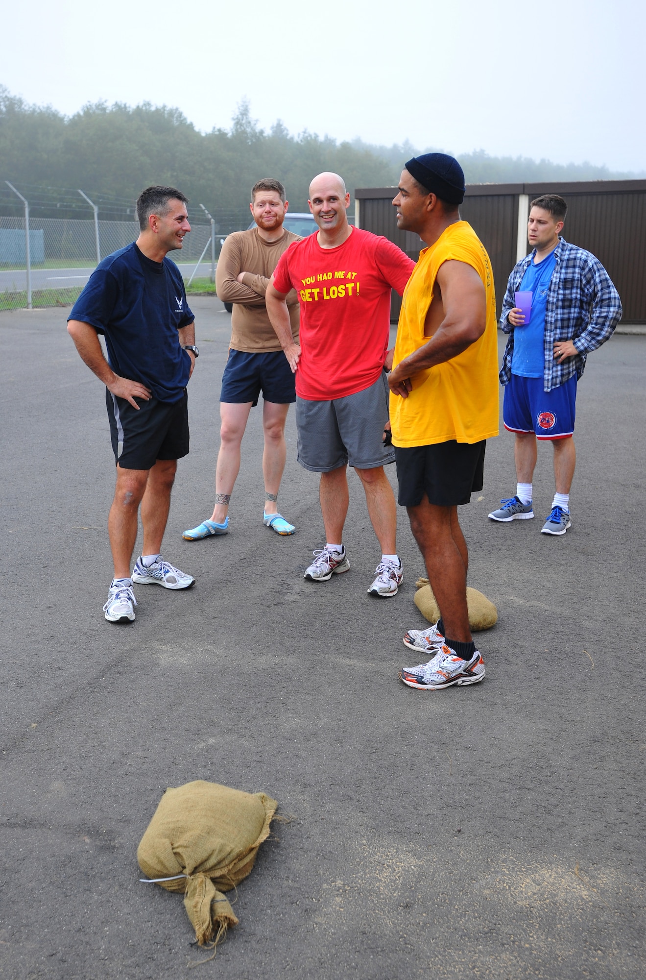 SPANGDAHLEM AIR BASE, Germany – Col. David Julazadeh, left, 52nd Fighter Wing vice commander, talks with Airmen assigned to the 52nd Civil Engineer Squadron Explosive Ordnance Disposal Flight after a morning workout here Aug. 15. Colonel Julazadeh met with the Airmen to better understand the EOD mission here. (U.S Air Force photo/Airman 1st Class Dillon Davis)