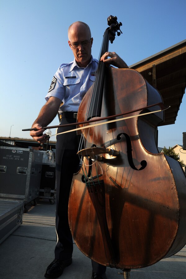 Chief Master Sgt. Paul Henry, Airmen of Note bass player and production NCO in charge, warms up before a performance at the Canal Place Festival Grounds in Cumberland, Md, on Sept. 1. This was the first stop the Airmen of Note made during their mini tour through the Midwest, leading up to their performance at the 2011 Detroit Jazz Festival. (U.S. Air Force photo/ Airman 1st Class Bahja J. Jones) 
