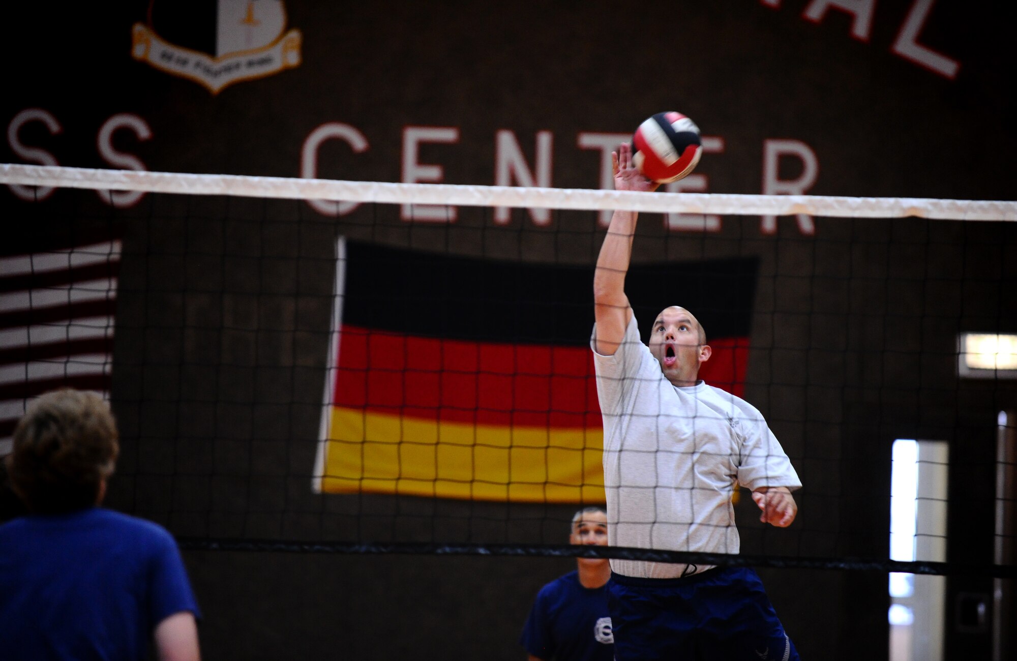 SPANGDAHLEM AIR BASE, Germany -- Michael Irons, Spangdahlem Chiefs, spikes the ball over the net during a friendly volleyball match against the Spangdahlem Commanders at the Skelton Memorial Fitness Center here Aug. 30. The Chiefs defeated the Commanders 15-12 the first game and 15-3 the second game. (U.S. Air Force photo/Staff Sgt. Nathanael Callon)