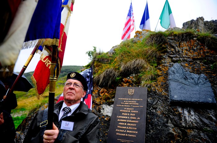 Retired French Army Major Jean-Jacques Riou posts a French flag Sept. 4, during the B-17 Flying Fortress Commemoration ceremony held at Bourg Saint Maurice, France. The commemoration ceremonies were for the crew of B-17 #43-39388 which crashed along the border of Courmayeur, Italy and Bourg Saint Maurice, France.  (U.S Air Force Photo/ Staff Sgt. Angelita M. Lawrence)