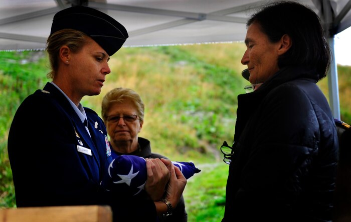 Lieutenant Colonel Rebecca Sonkiss presents the American Flag to Anne Cobb, daughter of U.S Air Force Maj. Lawrence Cobb, who was the co-pilot of the B-17 Flying Fortress Sept. 4 during the B-17  Commemoration ceremony held in Bourg Saint Maurice, France. The commemoration ceremonies honored the crew of B-17 #43-39388 which crashed along the border of Courmayeur, Italy and Bourg Saint Maurice, France in 1946. Sonkiss is the 15th Airlift Squadron commander. (U.S Air Force Photo/ Staff Sgt. Angelita M. Lawrence)
