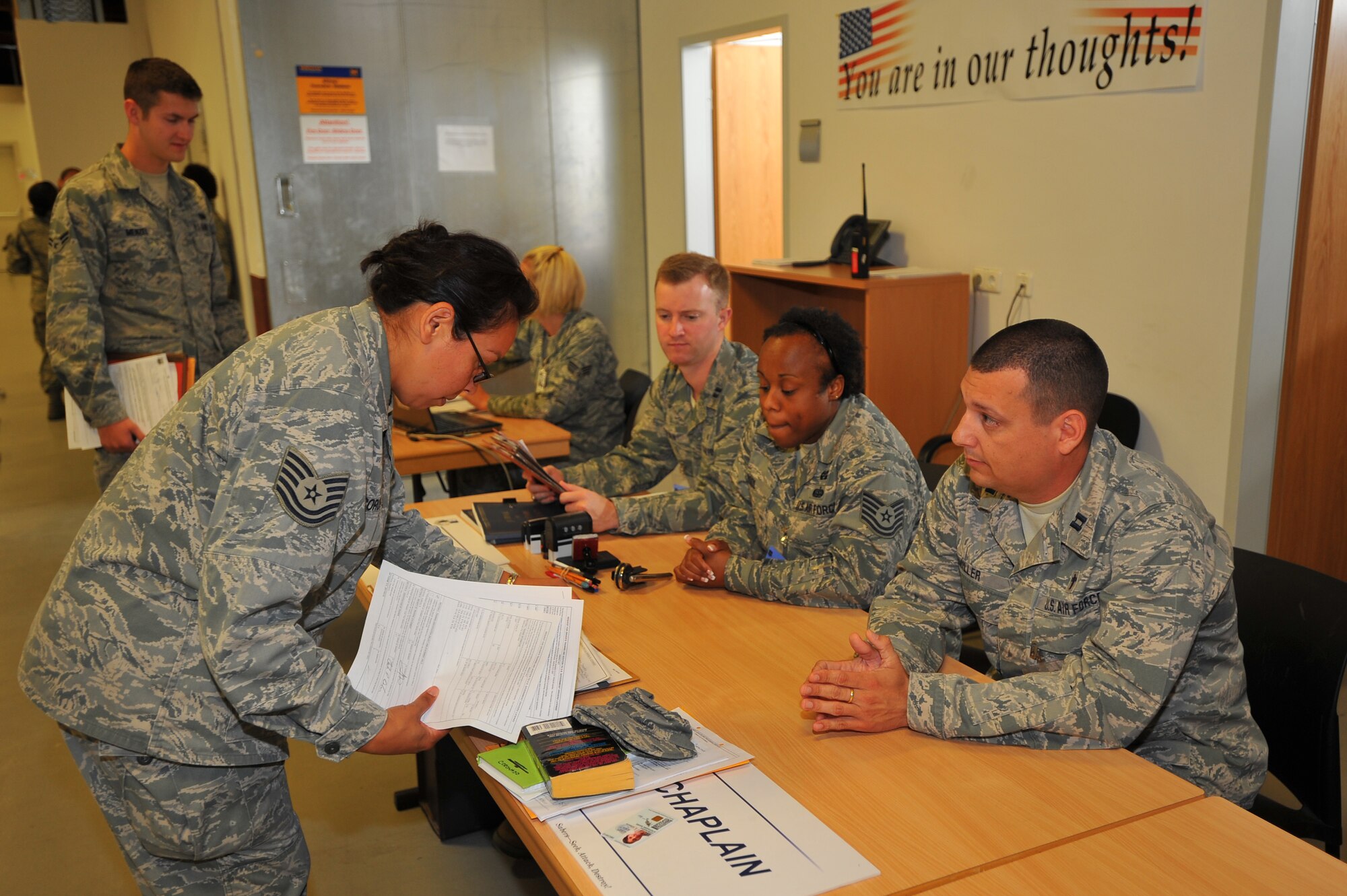 SPANGDAHLEM AIR BASE, Germany – Tech. Sgt. Stephanie Coronado, 606th Air Control Squadron, processes through the chaplain’s section during a personnel deployment function line here Sept. 6. The PDF line consists of various base agencies that ensure deploying members have all necessary paperwork and checklists completed before leaving. (U.S Air Force photo/Airman 1st Class Dillon Davis)