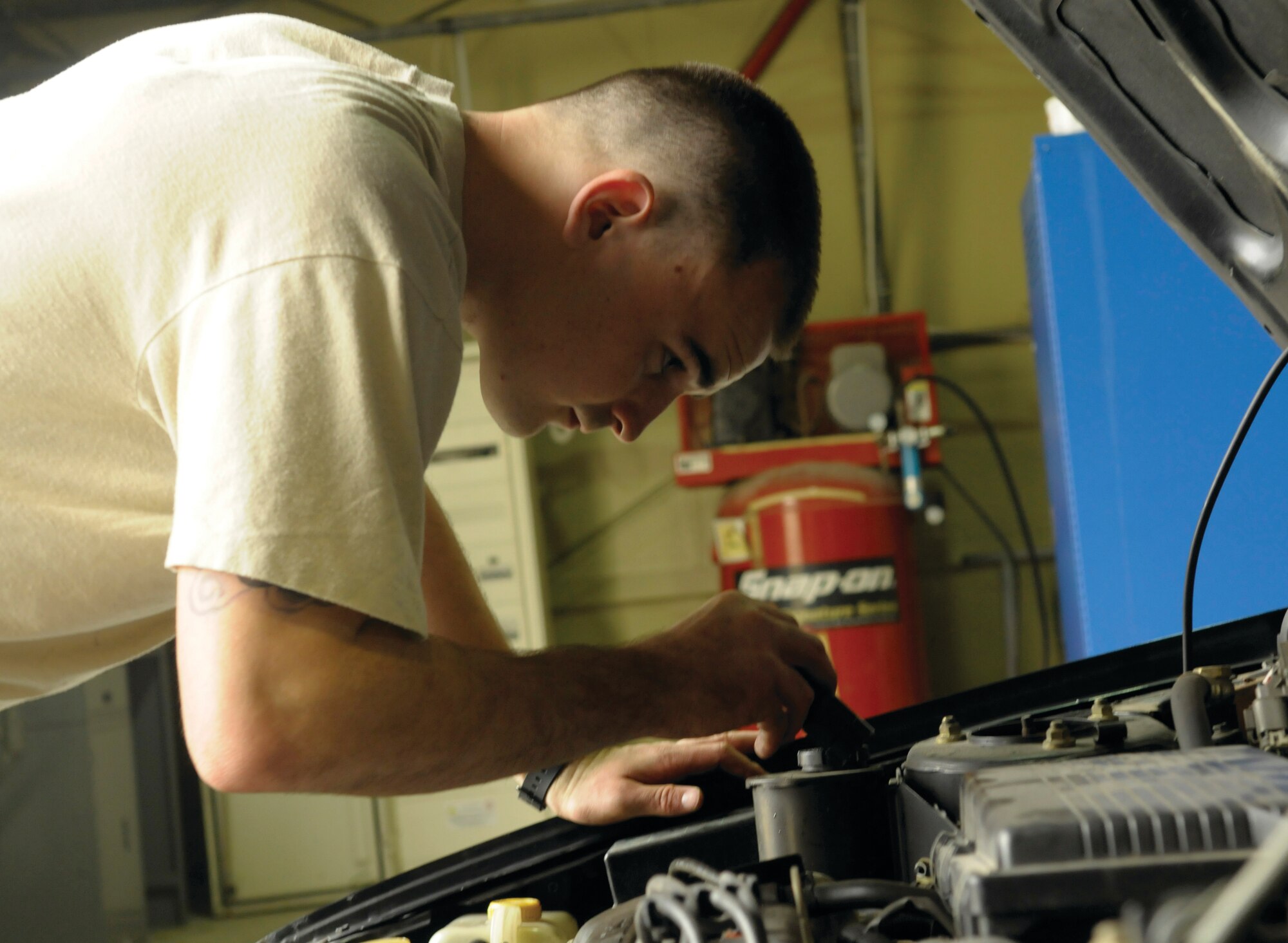 Senior Airman David Bell, 31st Logistics Readiness Squadron vehicle maintenance technician, inspects a car Sept. 1 at the privately owned vehicle, or “POV,” inspection point. Bell inspects more than 160 vehicles a week. A new 31st Security Forces Squadron Pass and Registration office has recently opened at the 31st Logistics Readiness Squadron privately owned vehicle inspection point, enabling customers to get their vehicles inspected and registered in one location. 