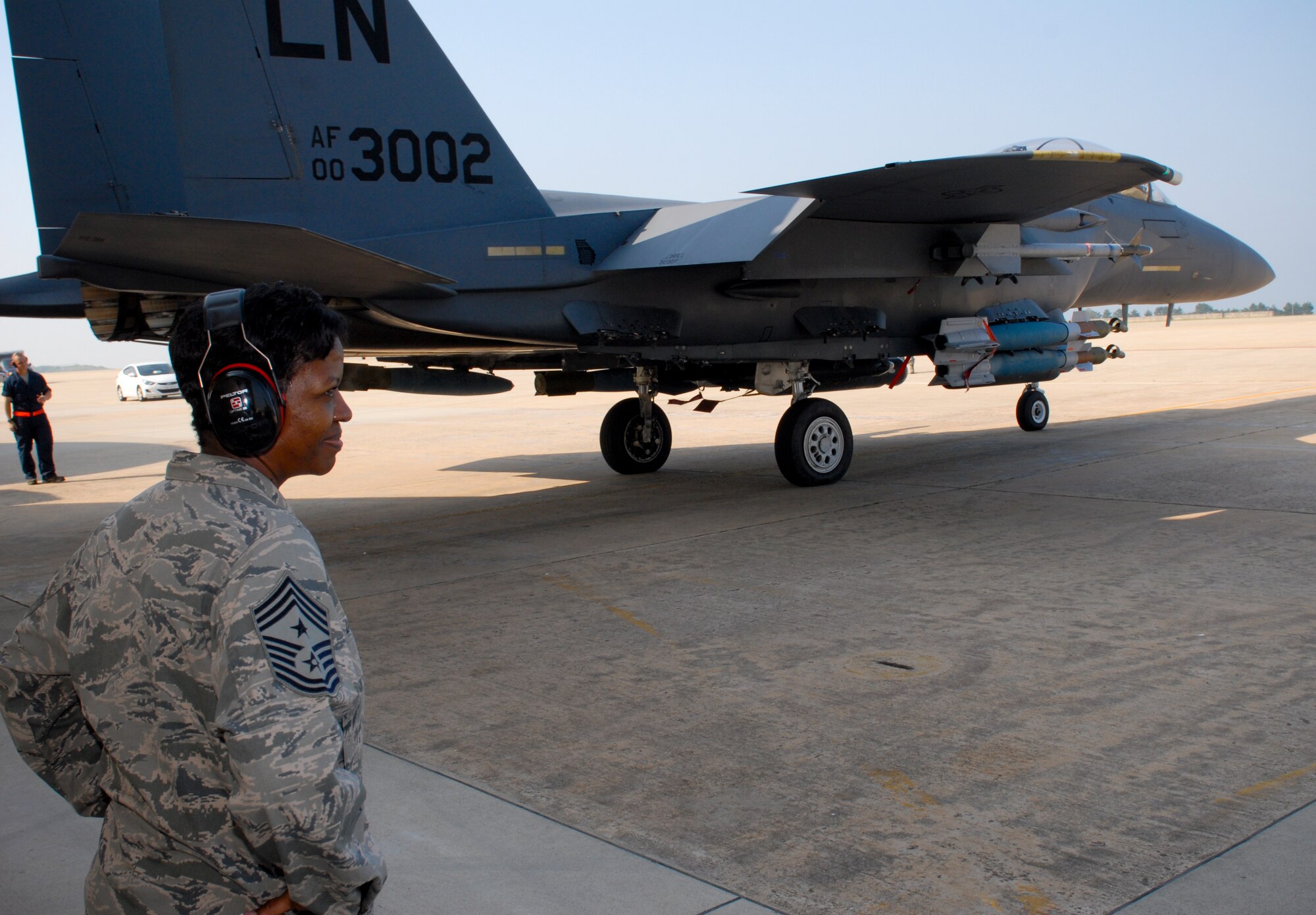 KUNSAN AIR BASE, Republic of Korea -- Chief Master Sgt. SaRita Lathan, 48th Fighter Wing command chief, watches as an F-15 Strike Eagle from the 48th FW, RAF Lakenheath, England, launches during her visit here Sept. 2. (U.S. Air Force photo/ Senior Airman Benjamin Stratton)