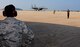 KUNSAN AIR BASE, Republic of Korea -- Chief Master Sgt. SaRita Lathan, 48th Fighter Wing command chief, watches as an F-15 Strike Eagle from the 48th FW, RAF Lakenheath, England, launches during her visit here Sept. 2. (U.S. Air Force photo/ Senior Airman Benjamin Stratton)