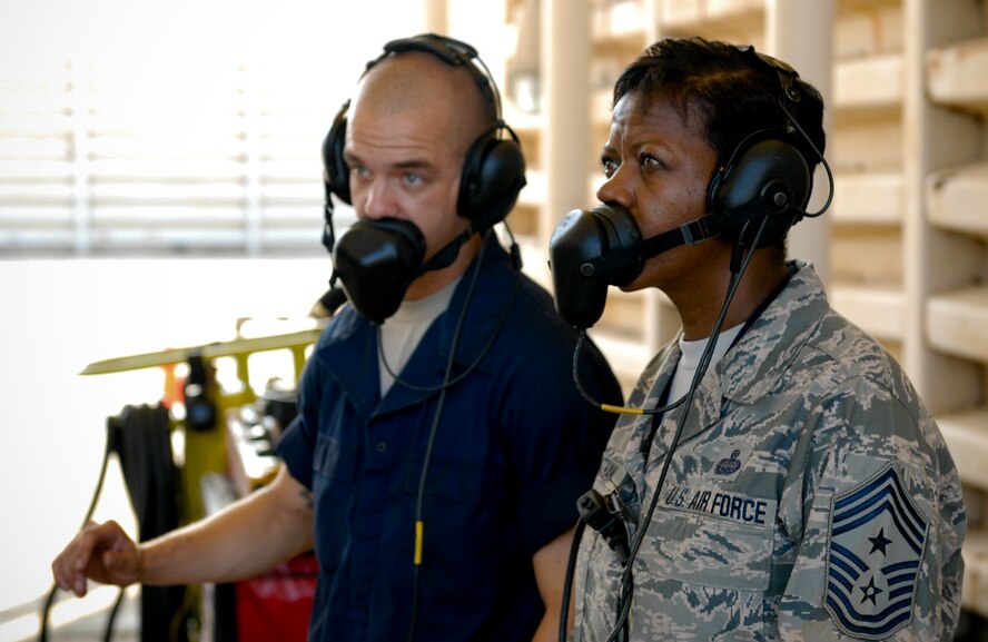 KUNSAN AIR BASE, Republic of Korea -- Staff Sgt. Jacob Mitchell, 494th Aircraft Maintenance Unit crew chief, goes over pre-launch procedures with Chief Master Sgt. SaRita Lathan, 48th Fighter Wing command chief, during the chief’s visit from RAF Lakenheath, England, here Sept. 2. (U.S. Air Force photo/ Senior Airman Benjamin Stratton)