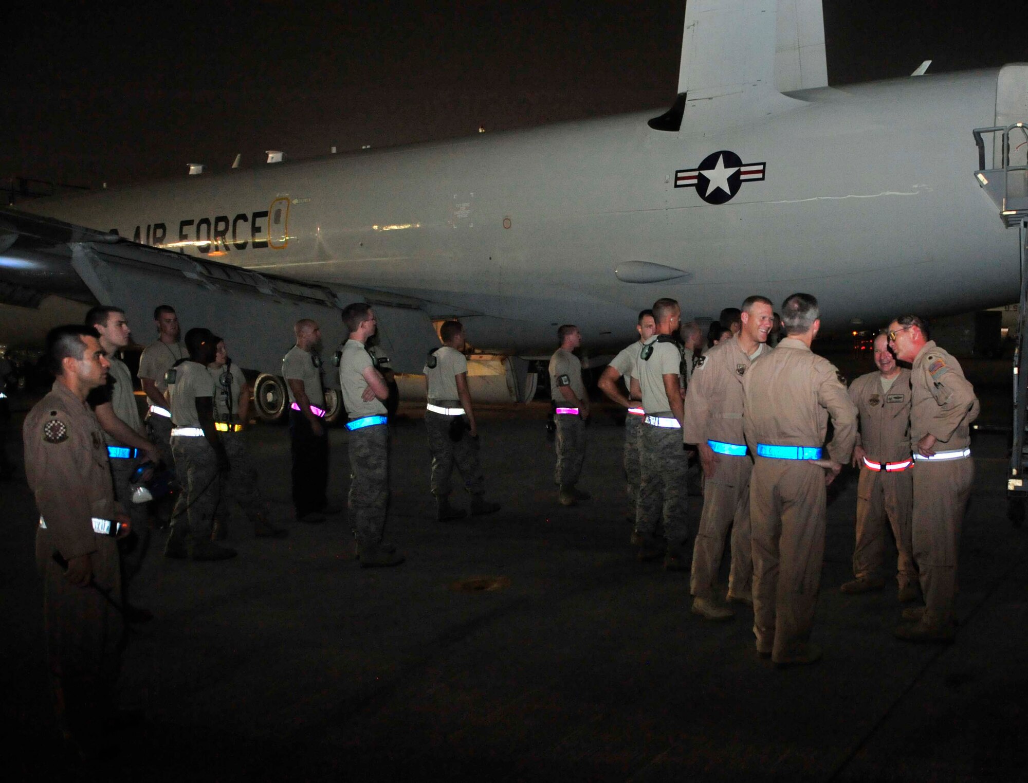 Maj. Jon Williams, a mission crew commander for the 963rd Expeditionary Airborne Air Control Squadron, talks with members of the 380th Air Expeditionary Wing leadership after setting a new Air Force flying record Sept. 5, 2011, at an air base in Southwest Asia. Williams reached 10,195 flying hours on the E-3 Sentry Airborne Warning and Control System, or AWACS, Sept. 5, setting the all-time record for hours flown since the aircraft became operational in the Air Force in 1977. Williams is deployed from Tinker Air Force Base, Okla. (U.S. Air Force photo/Tech Sgt. Patrick Mitchell)