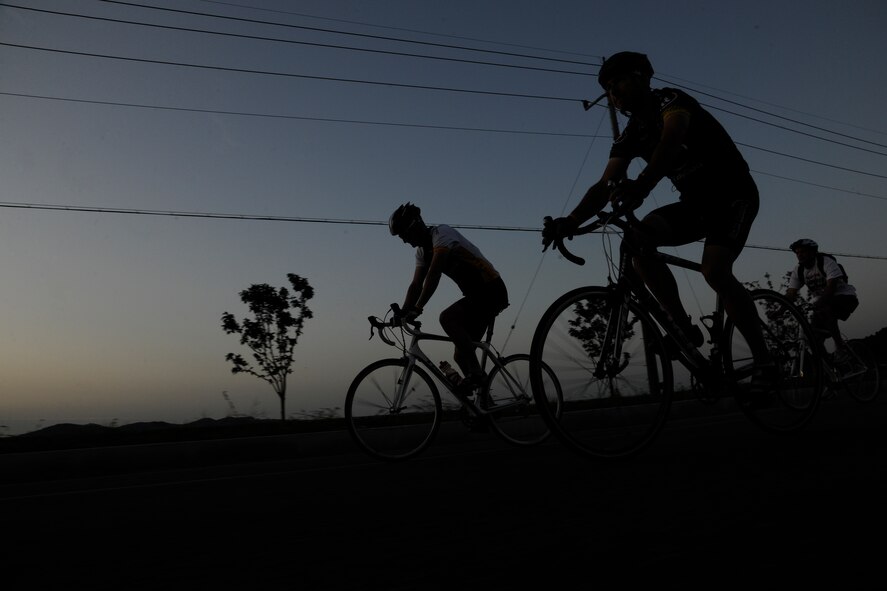 KUNSAN AIR BASE, Republic of Korea -- Three 8th Maintenance Squadron Airmen begin their more than 105 mile trek from Kunsan AB to Osan AB here Sept. 3 in support of The Lance Armstrong Foundation and to increase cancer awareness. The cycling trio raised more than $1,300 for the Combined Federal Campaign charity. (U.S. Air Force photo/Staff Sgt. Rasheen Douglas)